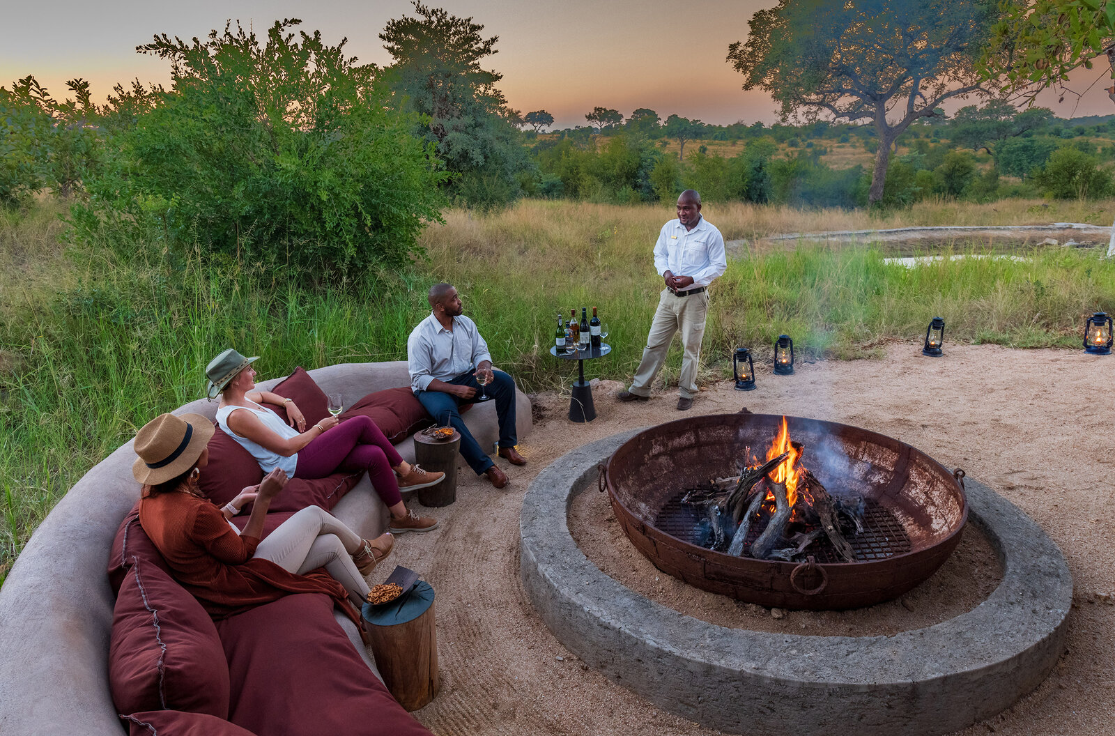 Sunset drinks around the fire pit at Sabi Sabi Earth Lodge