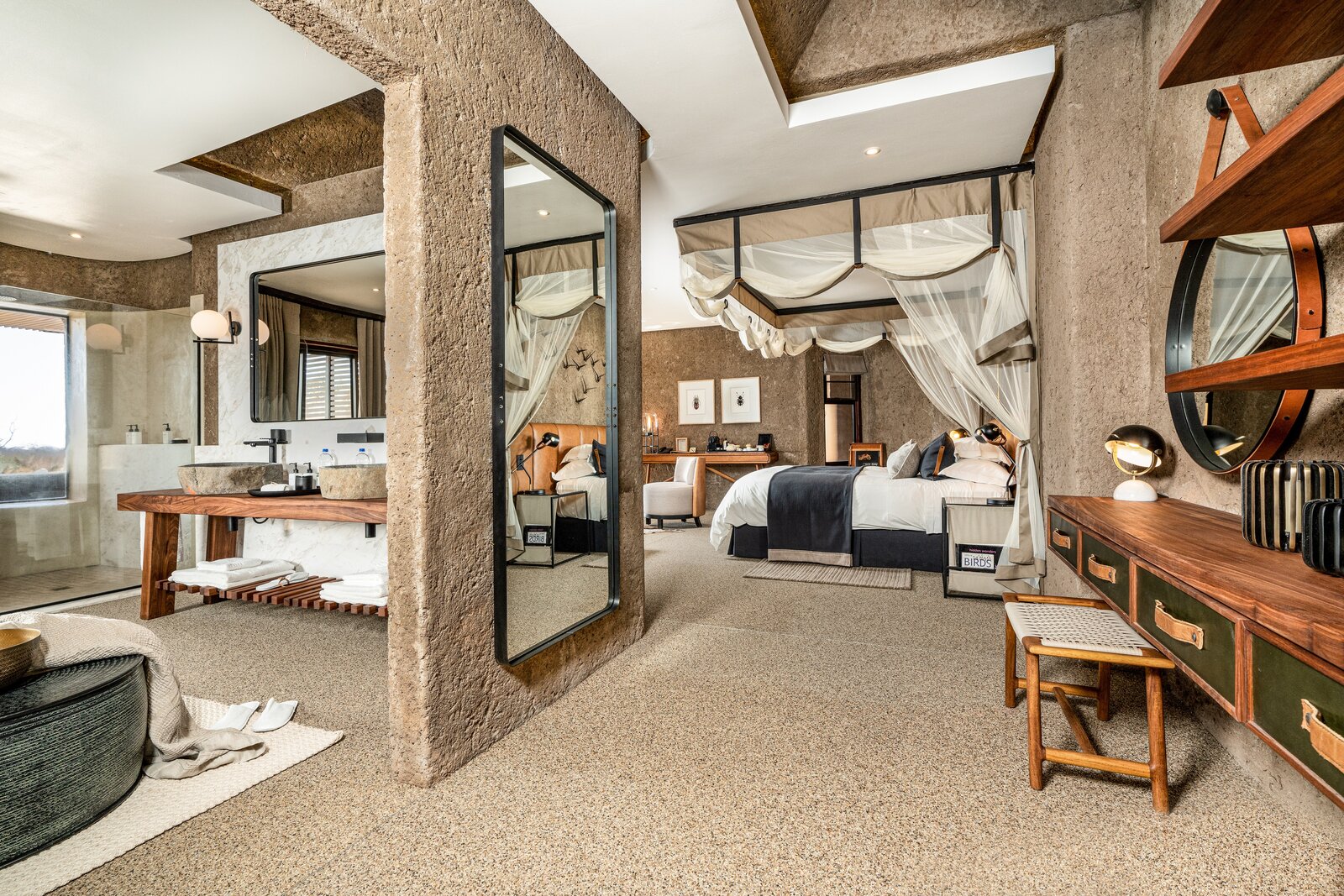 A suite dressing area at Sabi Sabi Earth Lodge with organic earth-tone design