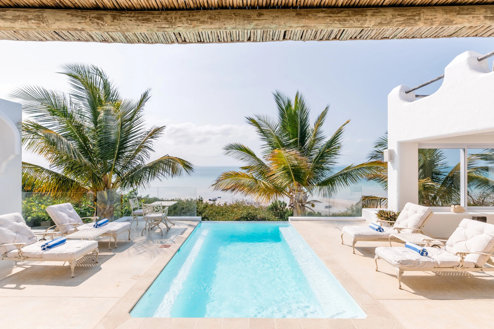 The pool and terrace of Villa da Praia at Santorini Mozambique overlooking the ocean near Vilanculos