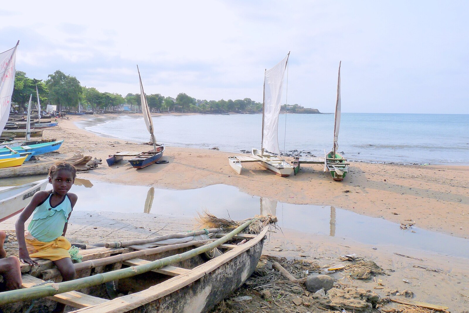 Traditional fishing boats drawn up on a beach in São Tomé and Príncipe