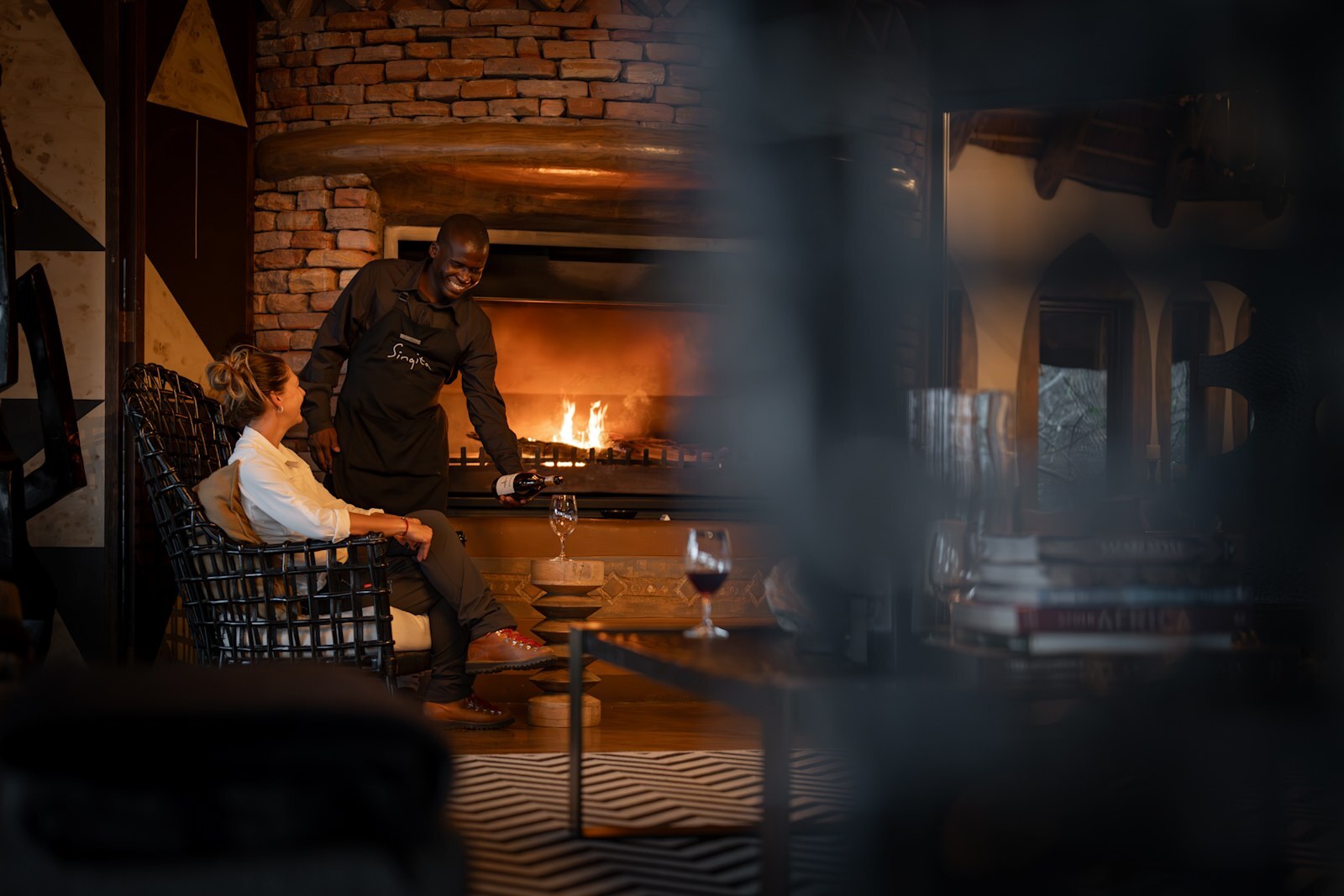 A private wine tasting by the fire at Singita Pamushana