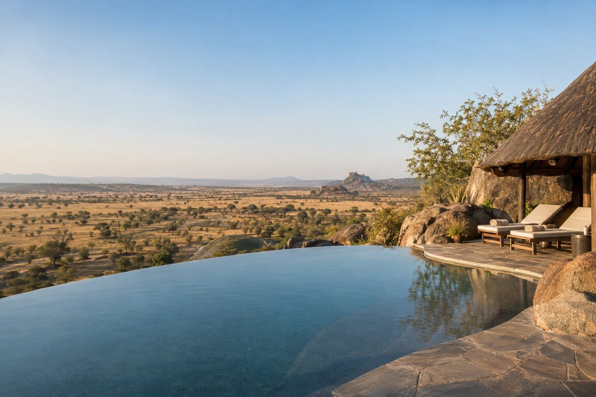 Infinity pool on a stone terrace looking out over the open Musabi Plains at Soroi Serengeti Lodge
