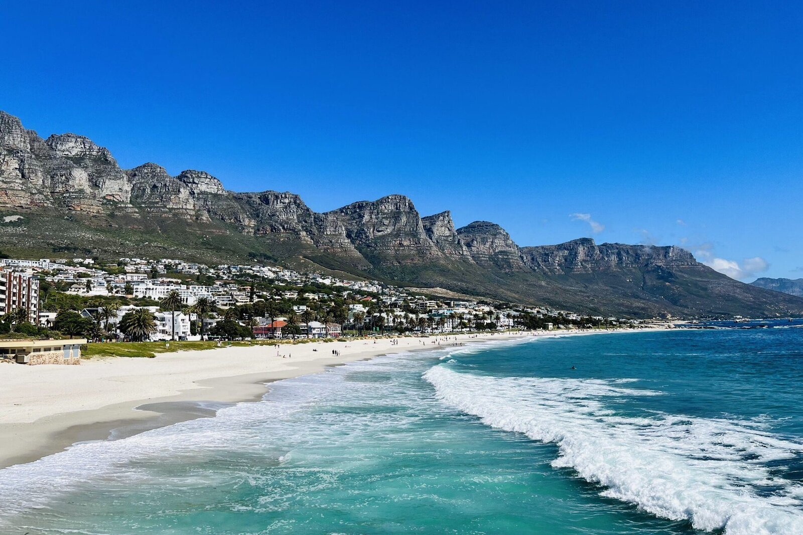 A barefoot-luxury Indian Ocean beach with turquoise water at a honeymoon retreat