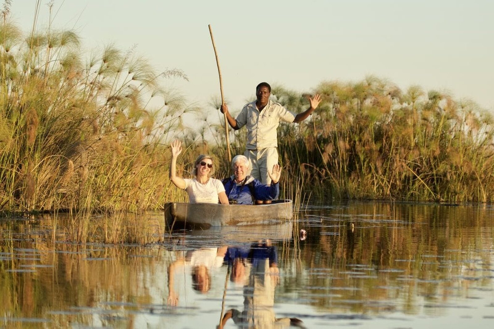 A mokoro canoe gliding through the Okavango Delta on a Southern Africa safari