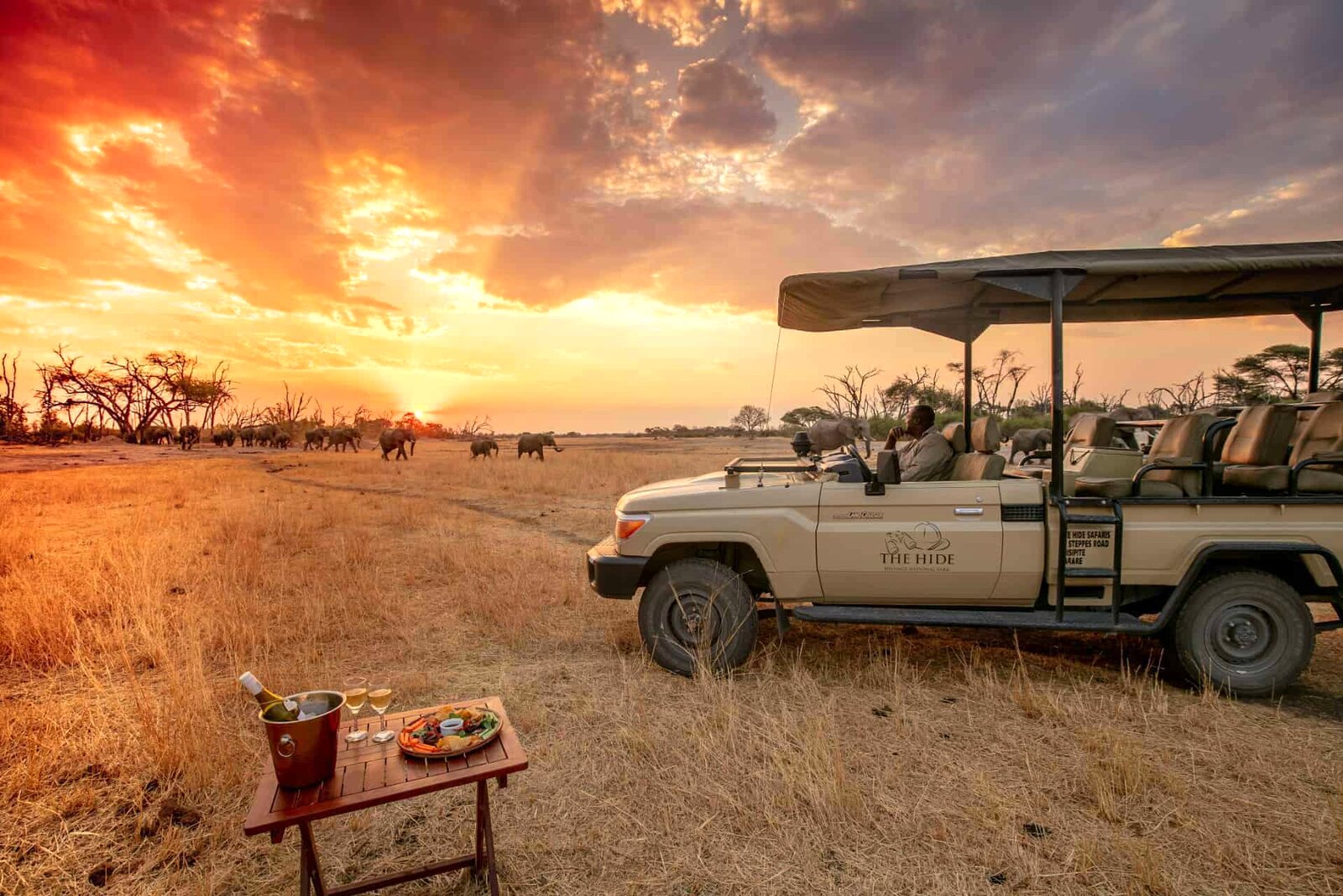 Sundowners beneath a blazing sky in Hwange National Park