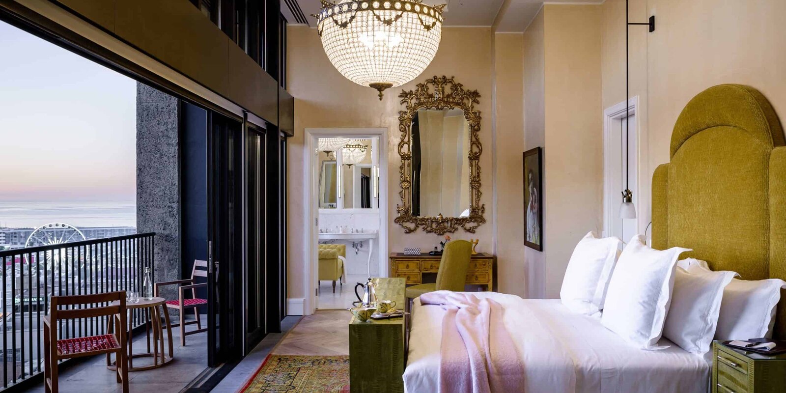 A top-floor suite bedroom at The Silo opening onto a private balcony over the Waterfront