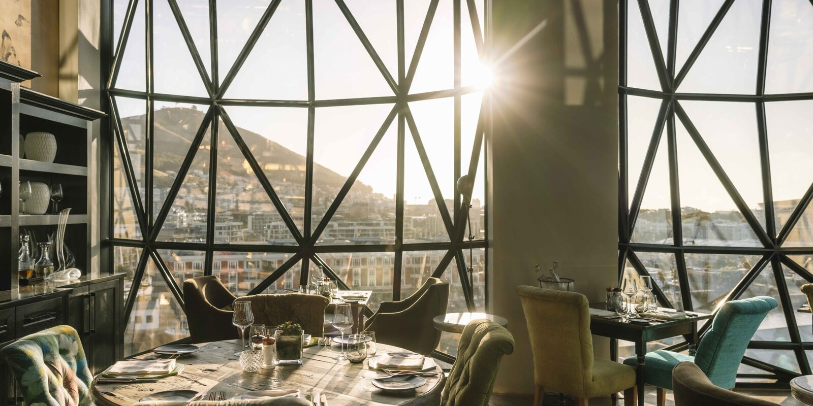 The Granary Café at The Silo Hotel under a sunburst of pillowed-glass windows