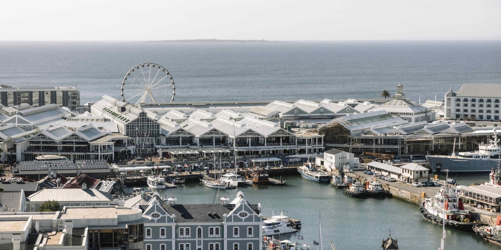 The view from The Silo Hotel rooftop across the V&A Waterfront marina and the city toward the sea, Cape Town