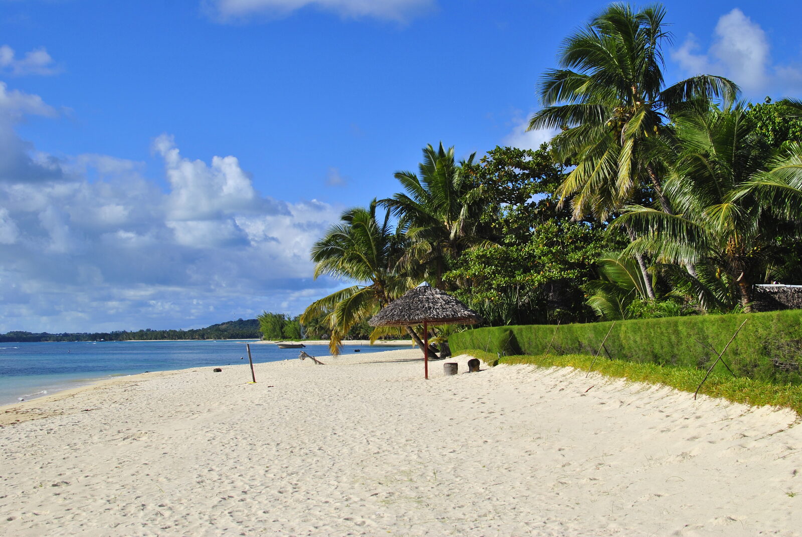 A white-sand beach with a thatched sun shade on Île aux Nattes, Sainte-Marie