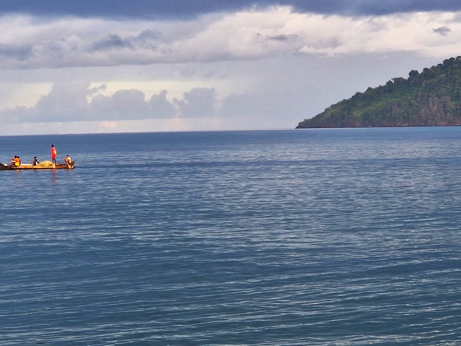 A pirogue crossing the calm channel off Nosy Be, Madagascar