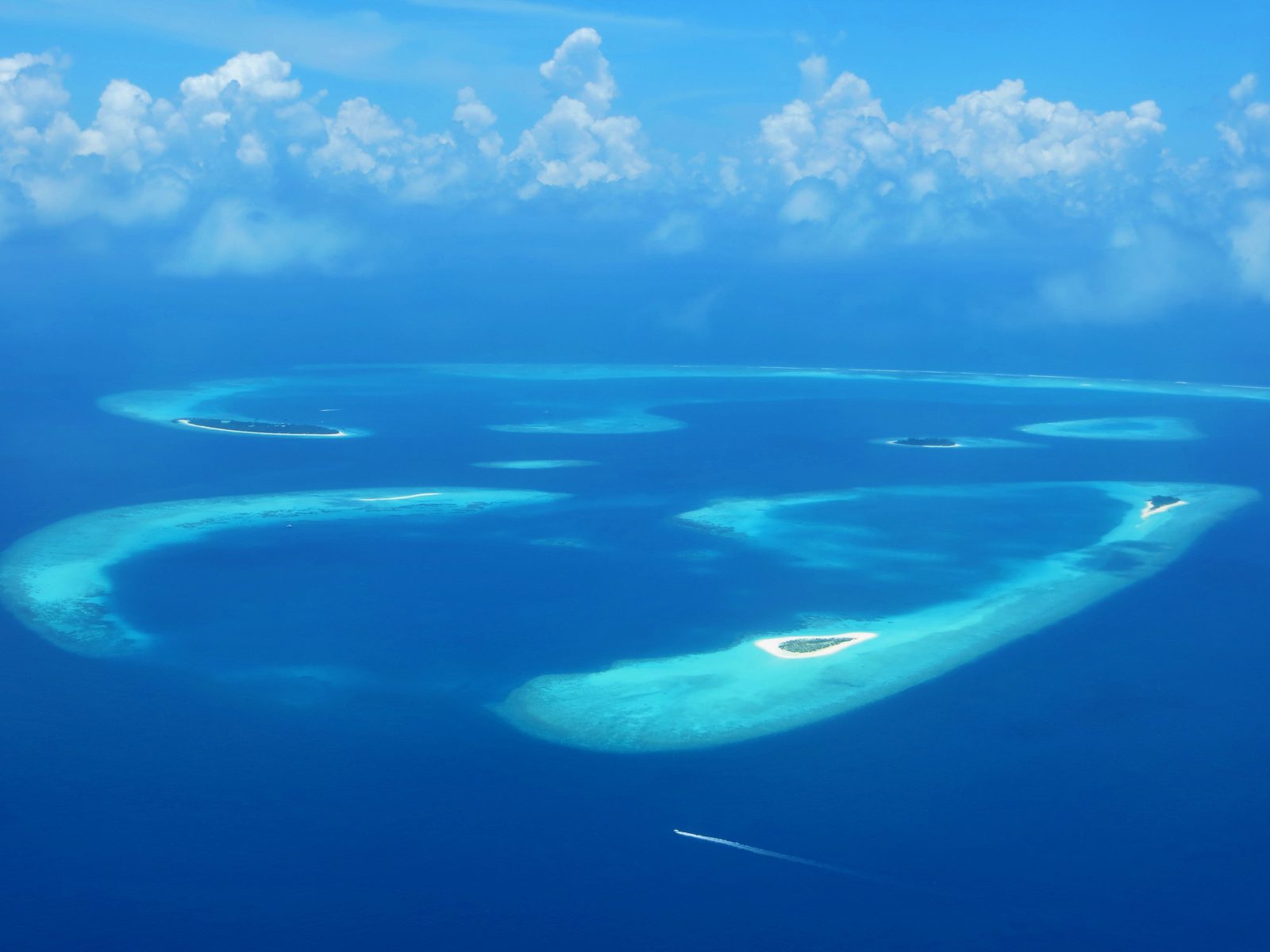 Aerial view of a Maldives island and turquoise lagoon