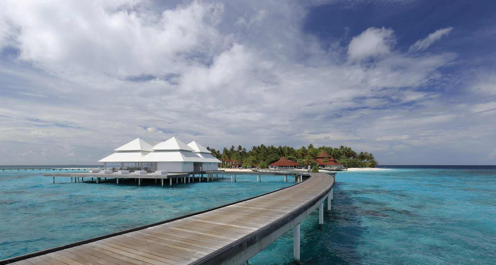 Overwater villa on stilts above a clear Maldives lagoon