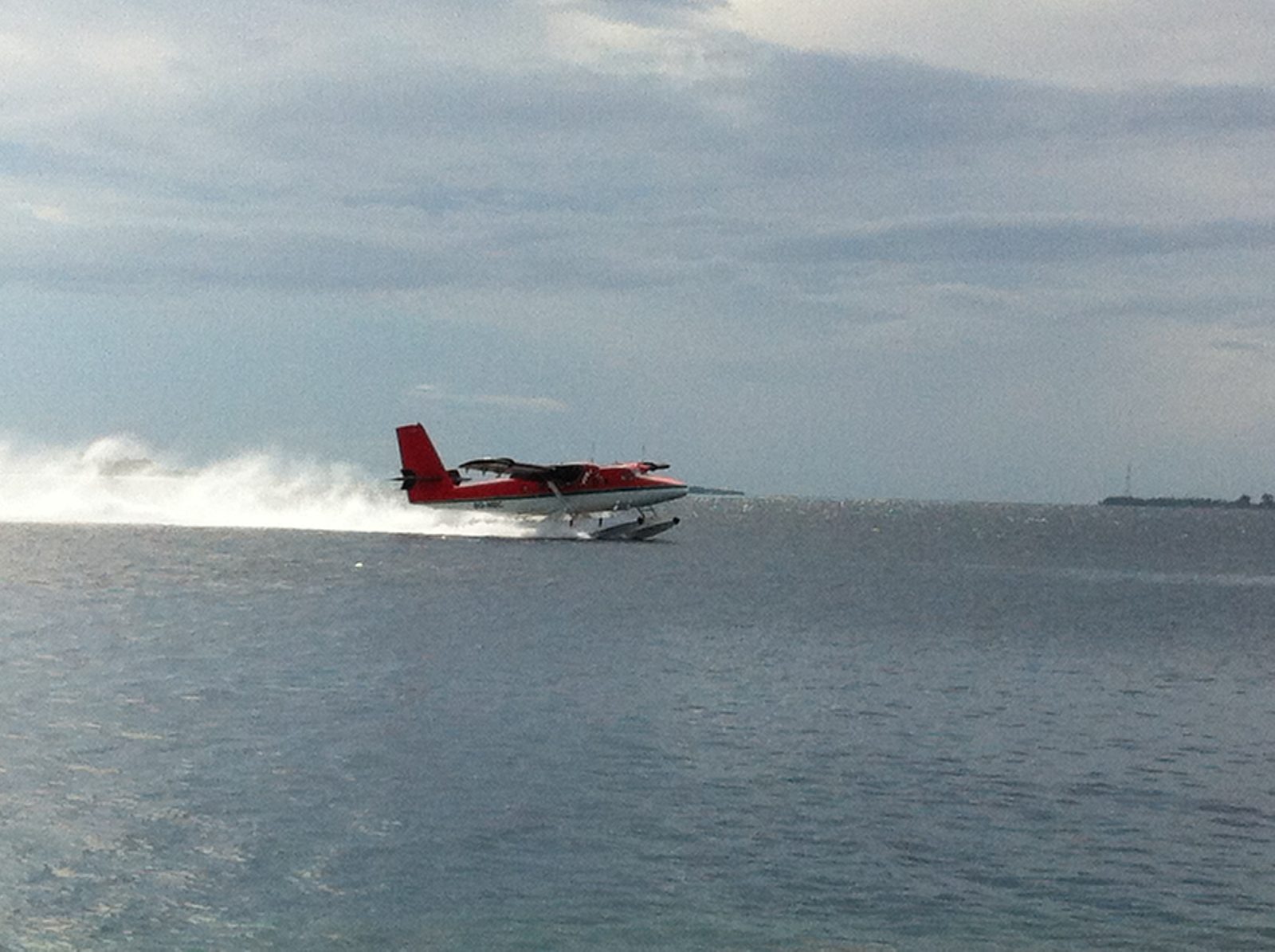 Seaplane beside a Maldives resort jetty