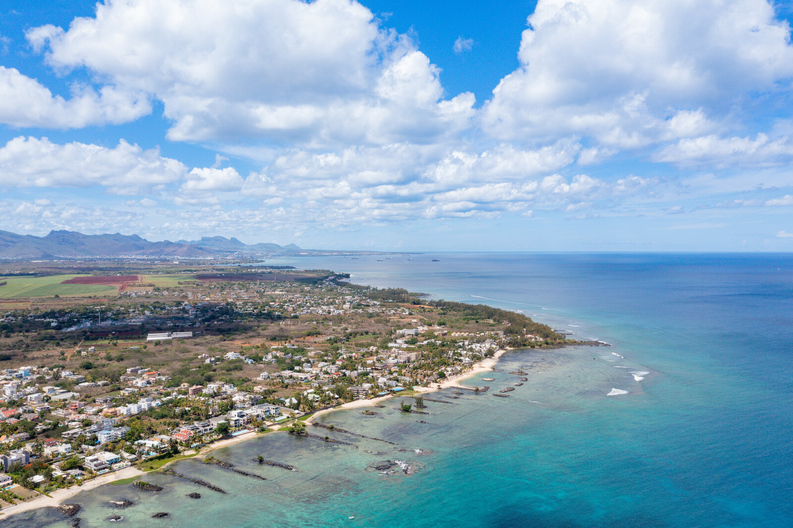 Shallow turquoise lagoon inside the reef on the north coast of Mauritius