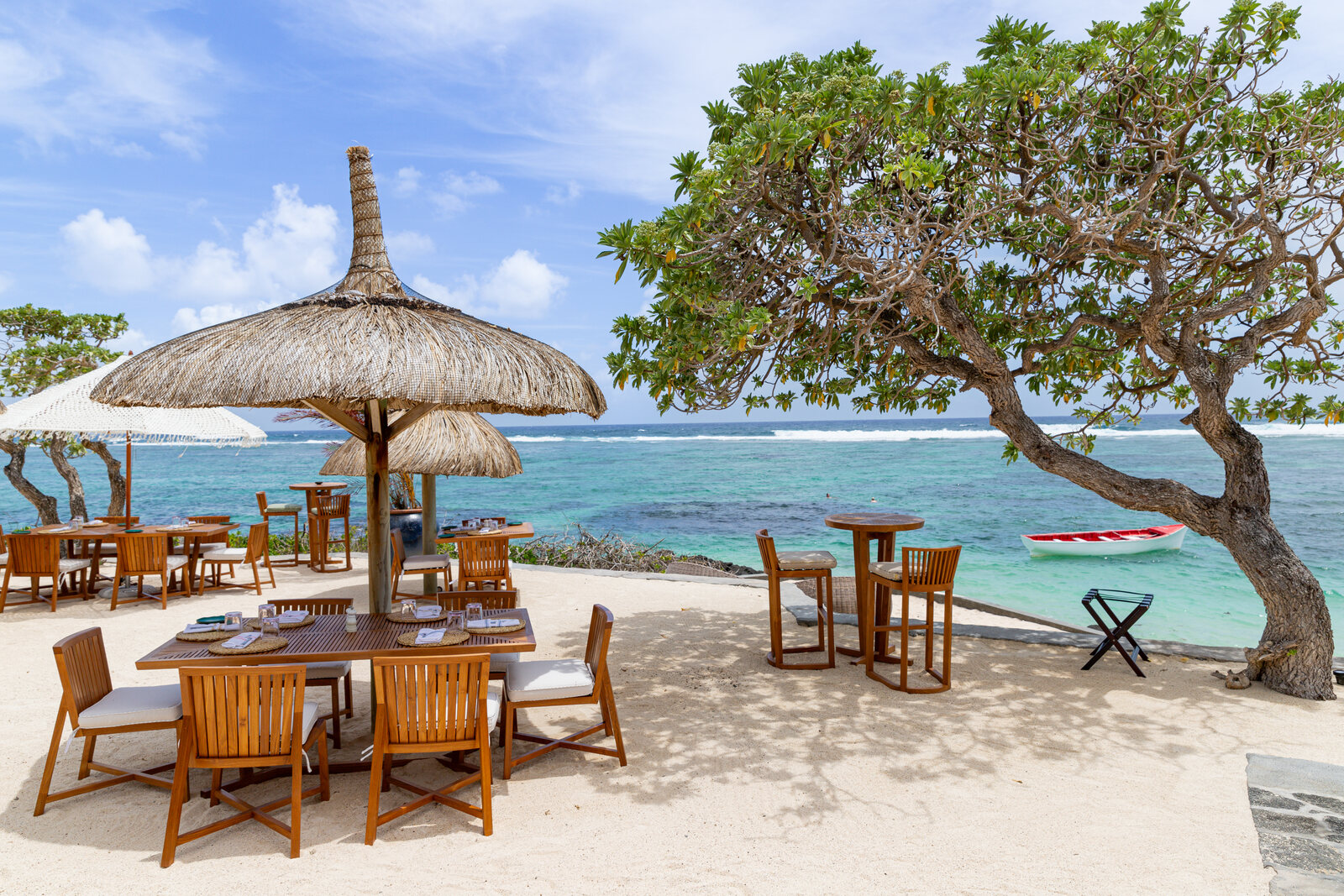 Lunch under a thatched parasol at the lagoon's edge in Mauritius