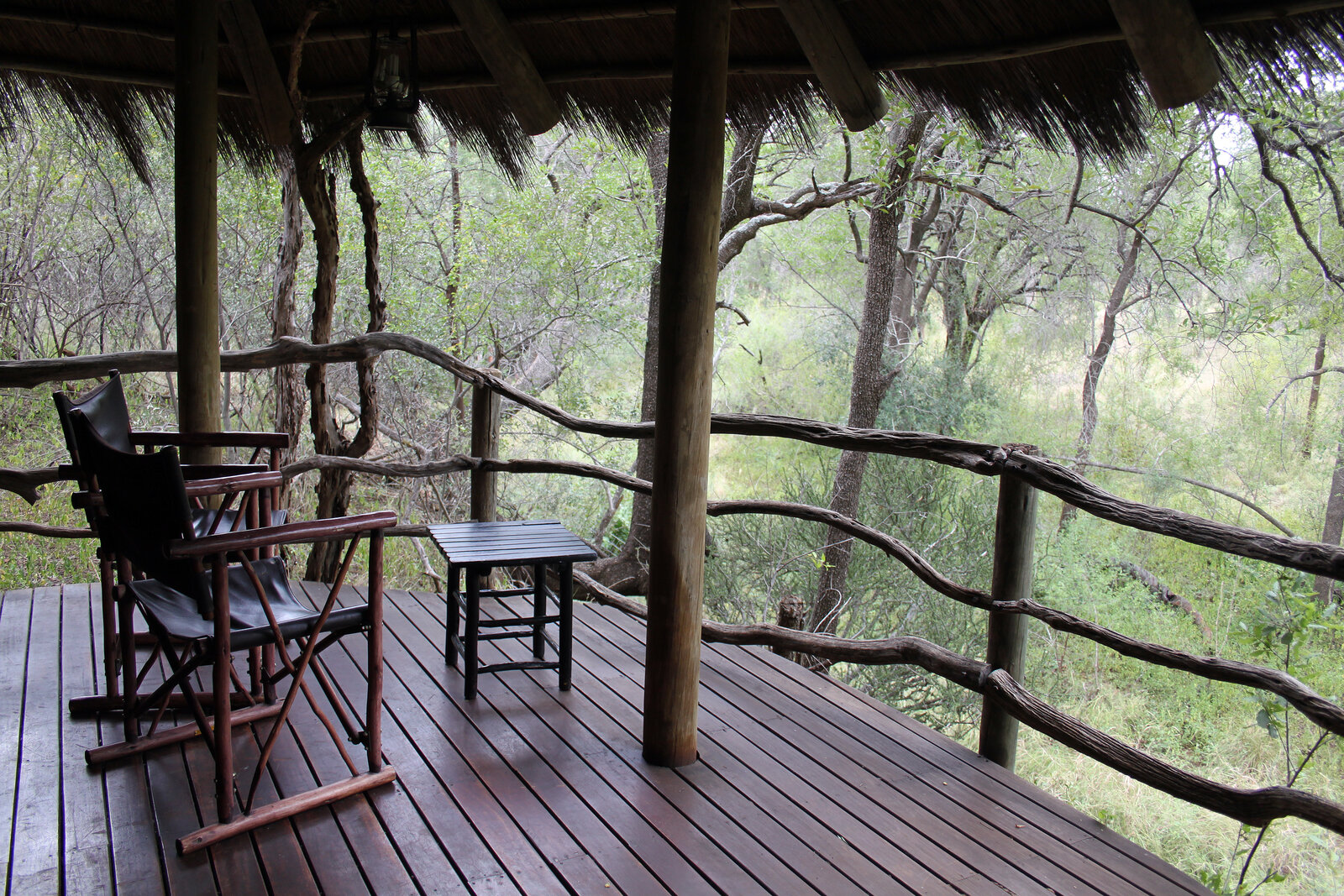 A luxury safari lodge deck at dusk, the safari half of a Cape Town and safari combo in South Africa