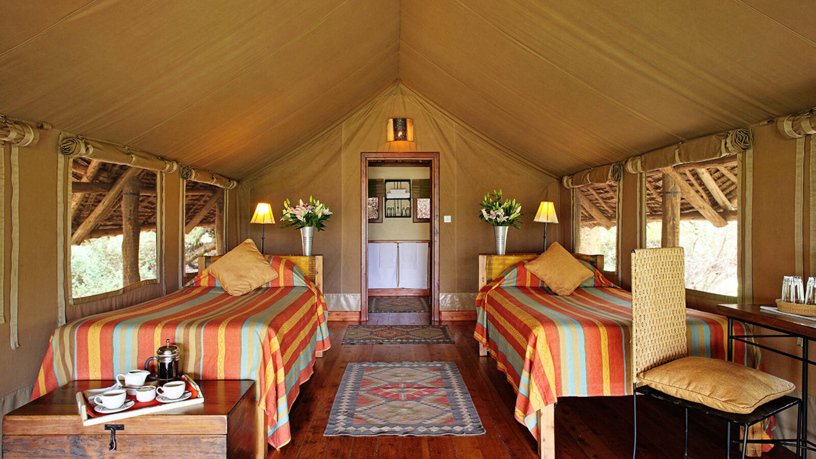 Tortilis Camp standard tent interior — twin beds with Kilimanjaro view