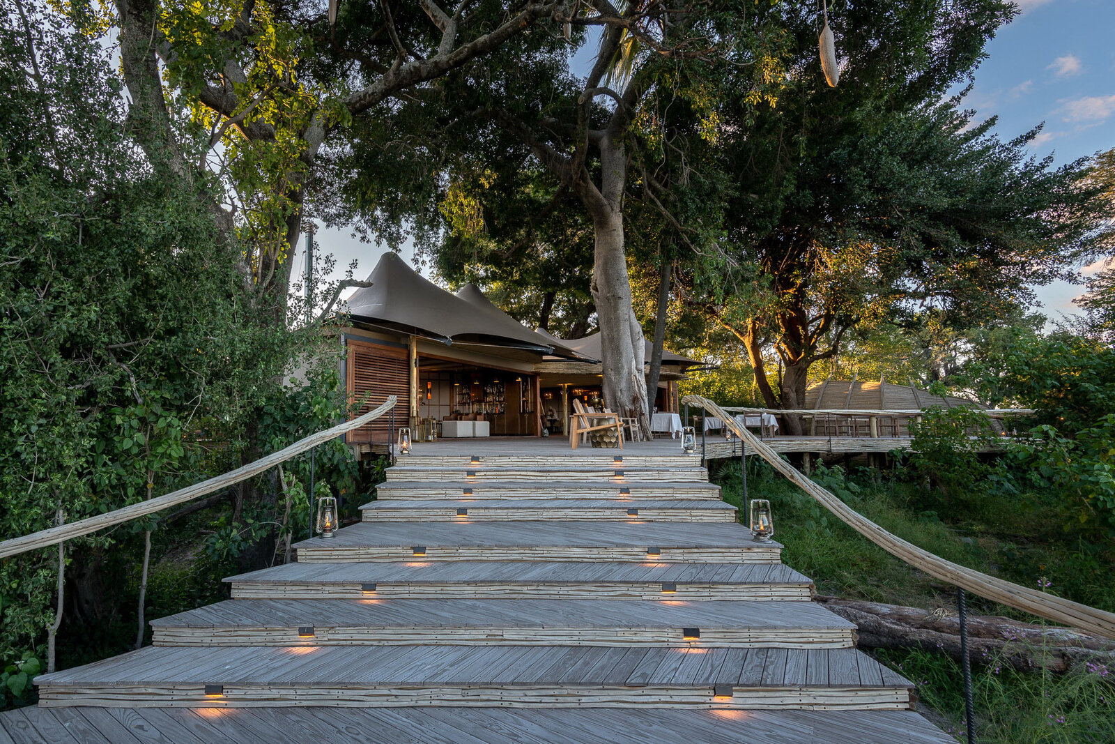 Boardwalk leading to a luxury delta lodge