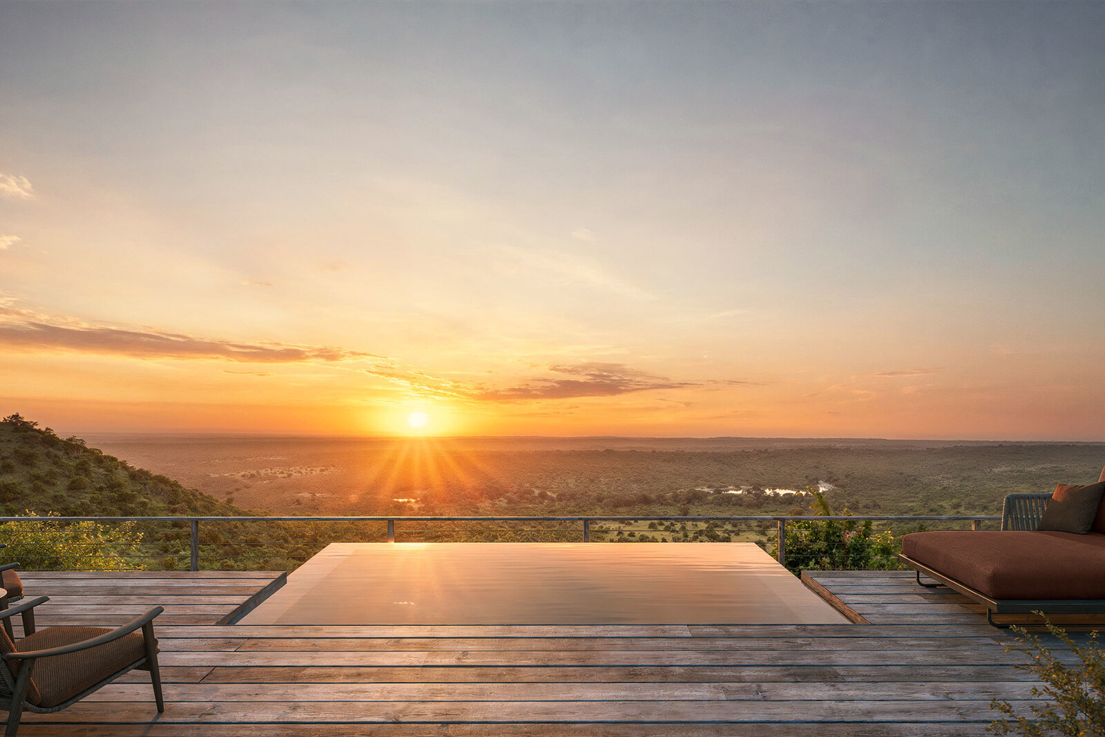 Rock Lodge infinity pool at sunset with panoramic bush views
