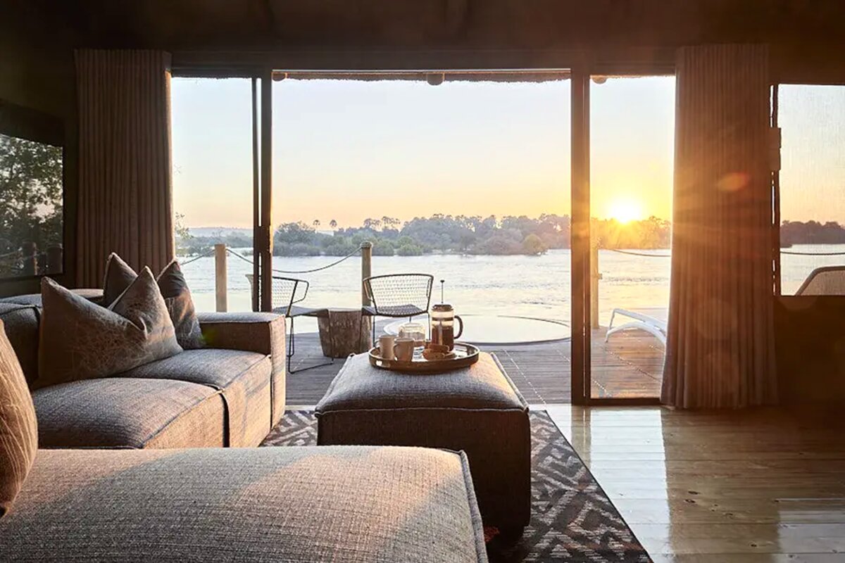 Suite deck with daybeds and tea at sunset over the Zambezi