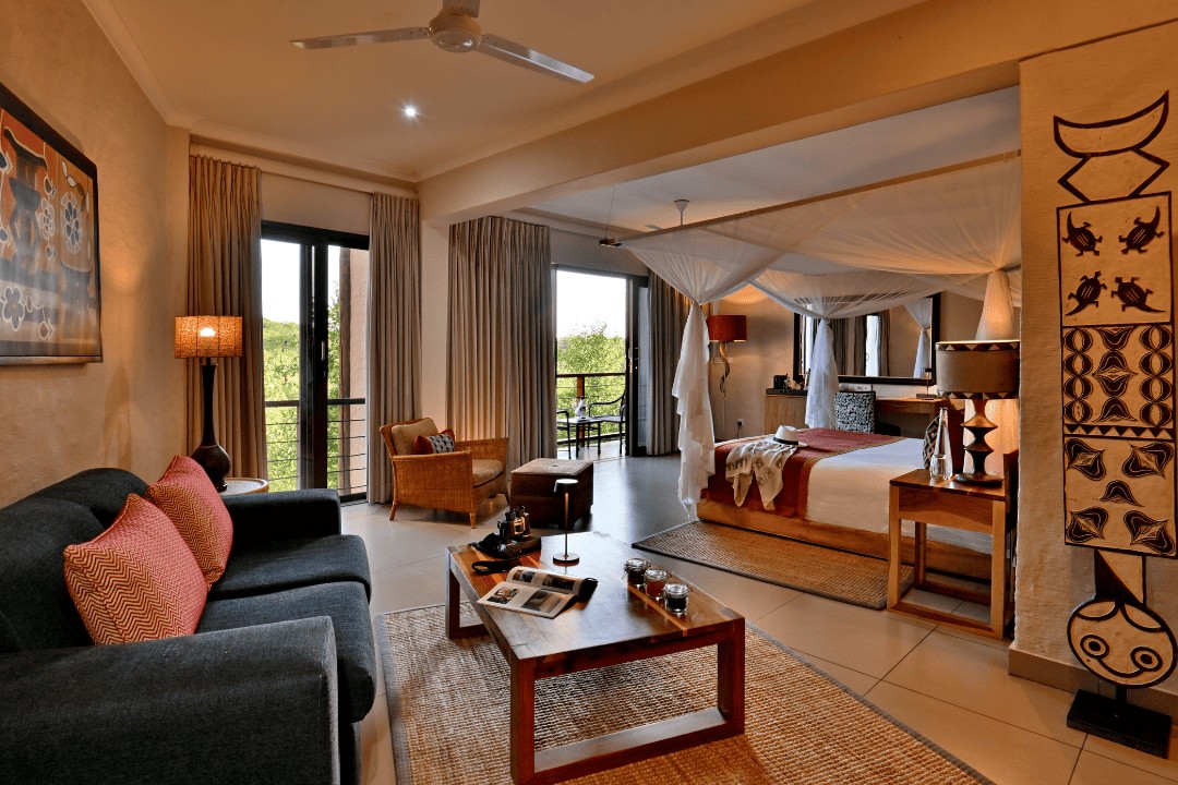 A Club Suite at Victoria Falls Safari Club with a separate lounge beside the bedroom