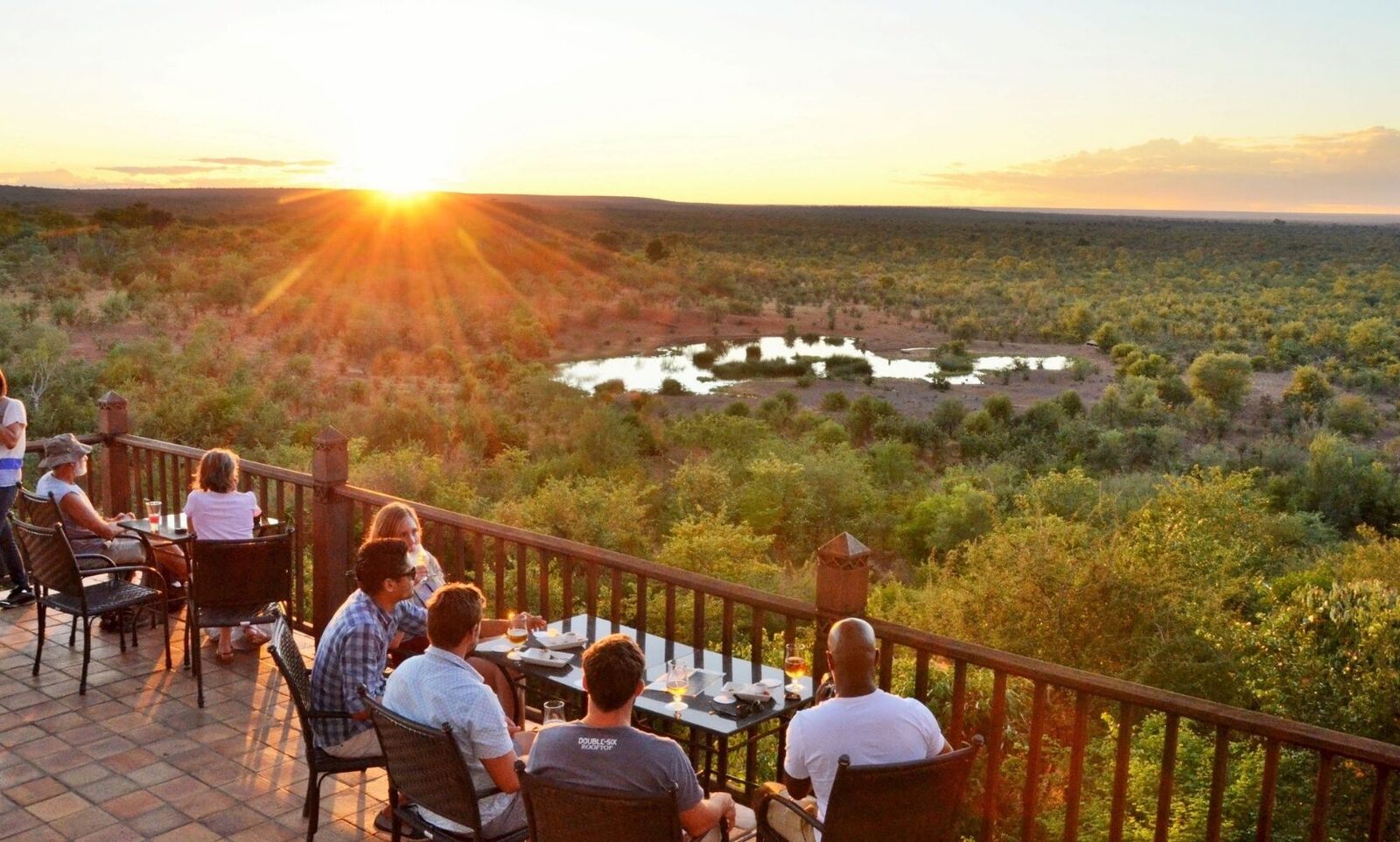The Buffalo Bar sunset deck overlooking the waterhole at Victoria Falls Safari Lodge