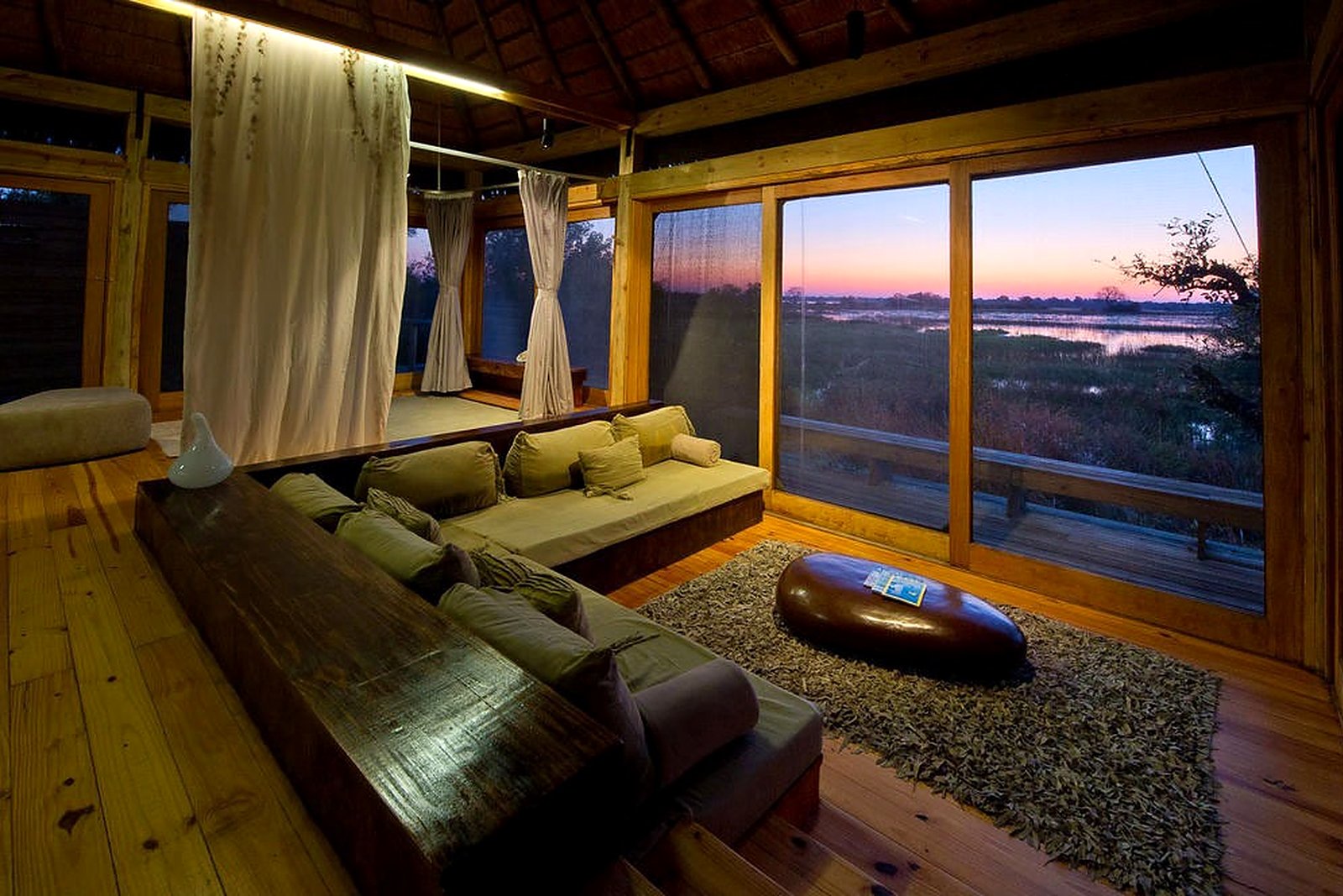 Suite at sunset over the floodplain at Vumbura Plains
