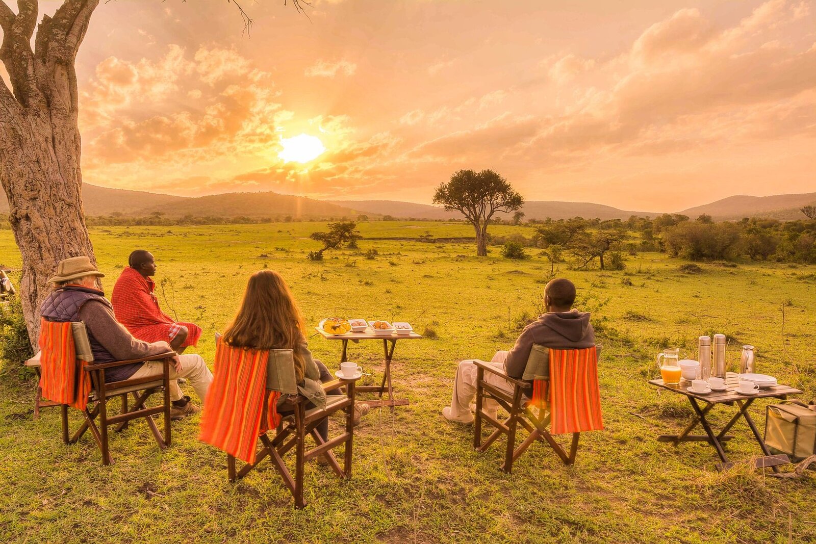 A private sundowner set-up in the African wilderness at golden hour