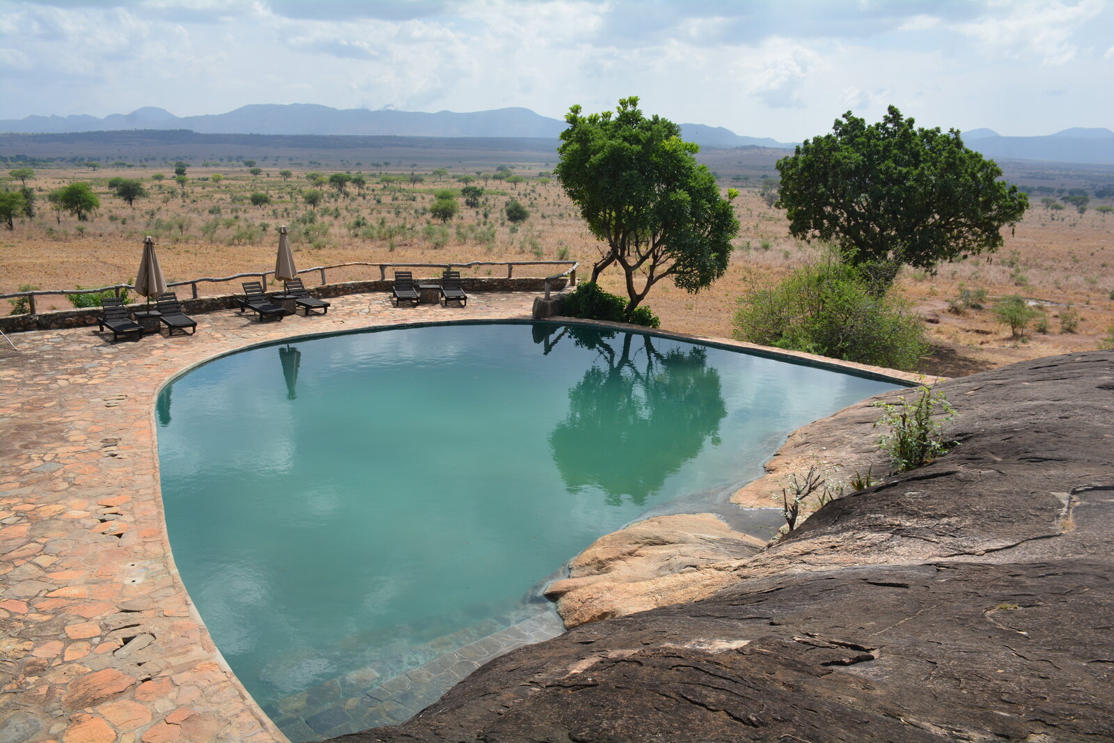 A rock swimming pool at a safari lodge where guests rest during the midday siesta