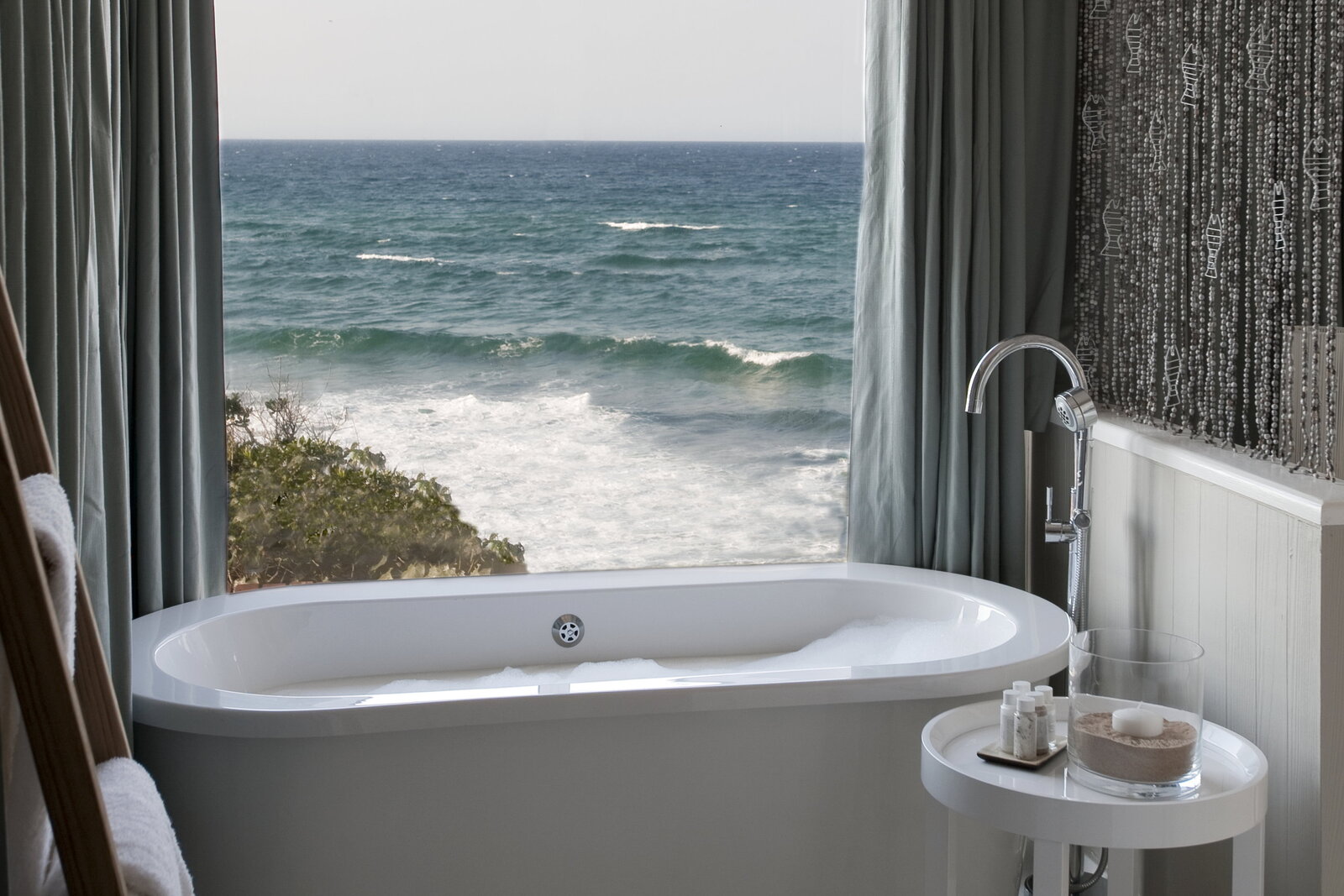 A suite bathroom with freestanding bath and ocean view at White Pearl Ponta Mamoli, southern Mozambique