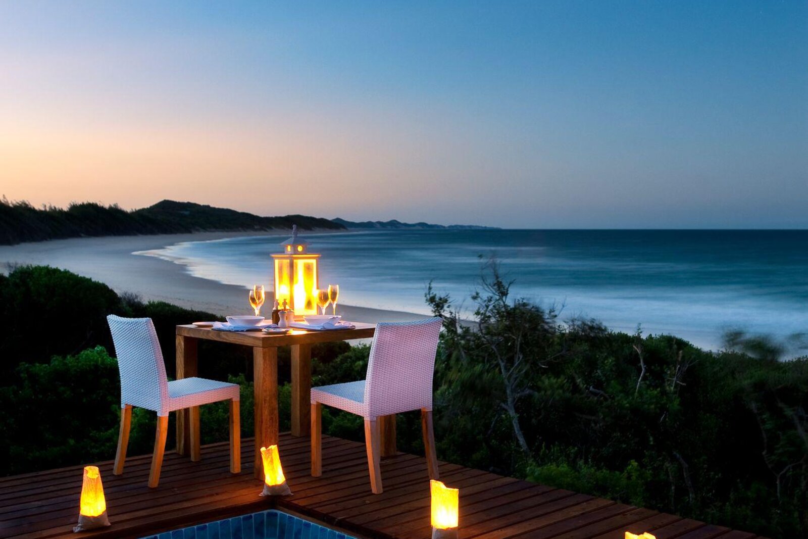 A candlelit dinner on the dune at sunset at White Pearl Ponta Mamoli, southern Mozambique