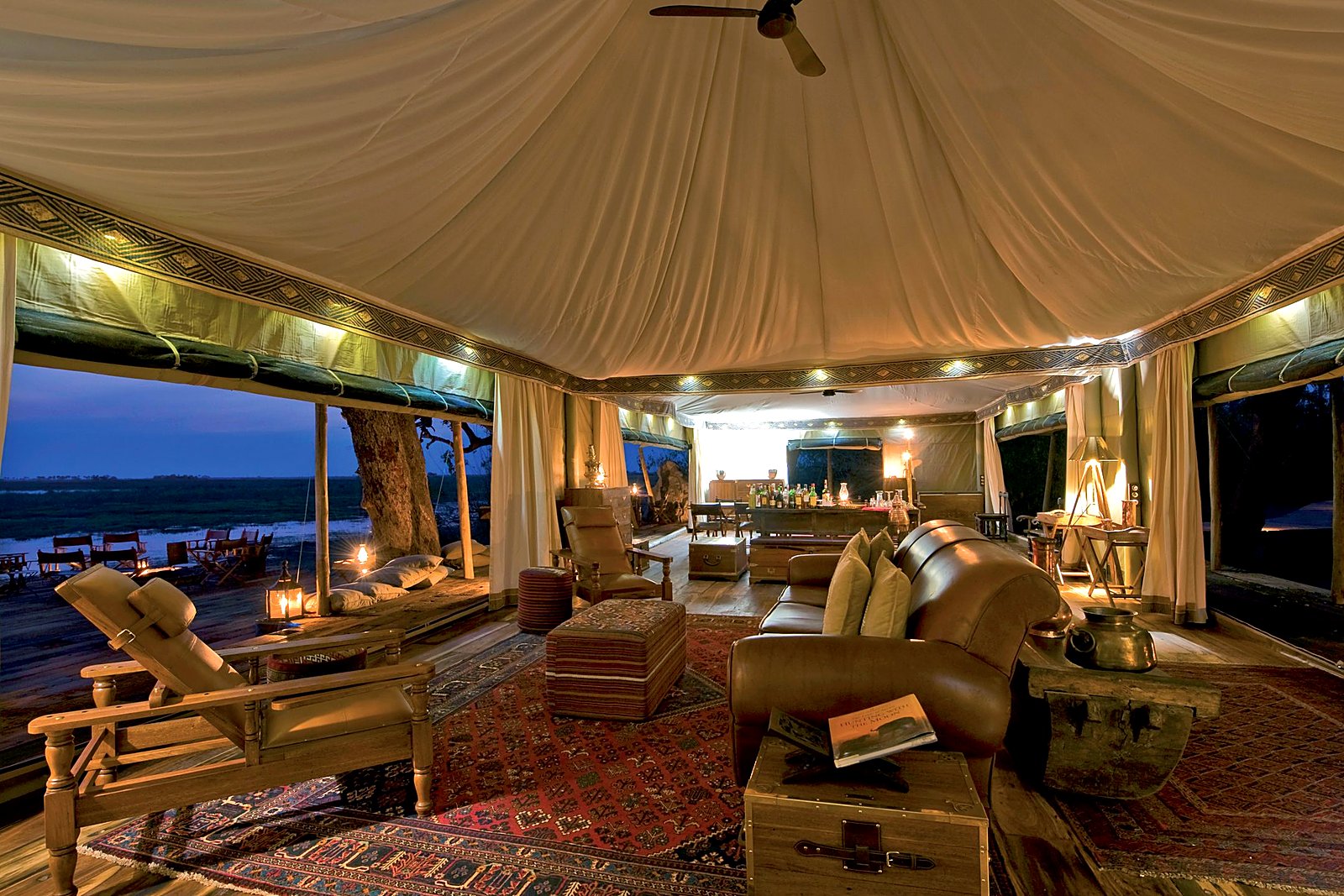 Tented lounge overlooking the lagoon at Zarafa Camp in Botswana's Selinda Reserve
