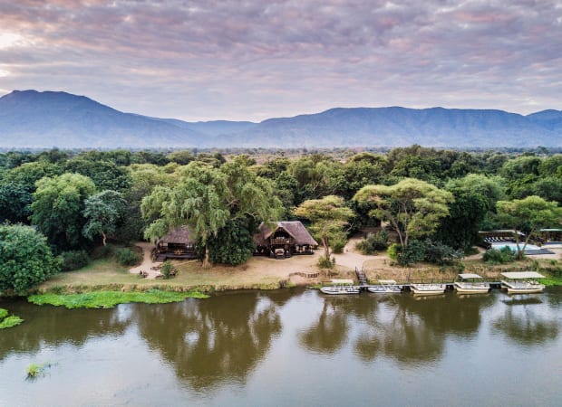 Aerial view of a riverside safari camp on the Zambezi in the Lower Zambezi