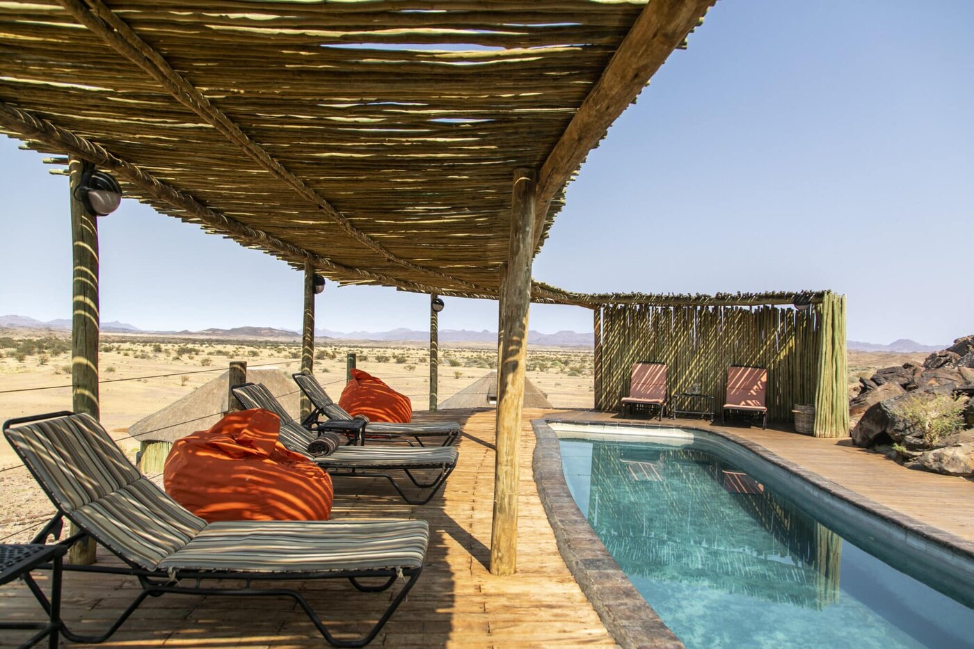Swimming pool and desert views at Doro Nawas Camp, Damaraland