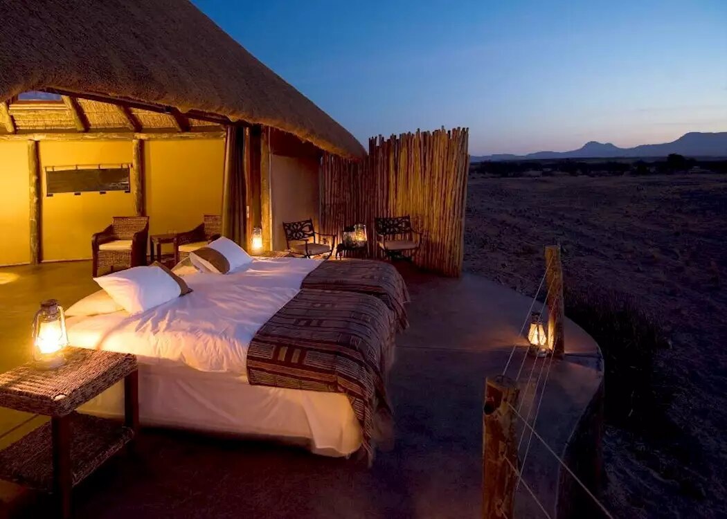 Stone-and-canvas guest room at Doro Nawas Camp in Damaraland, Namibia