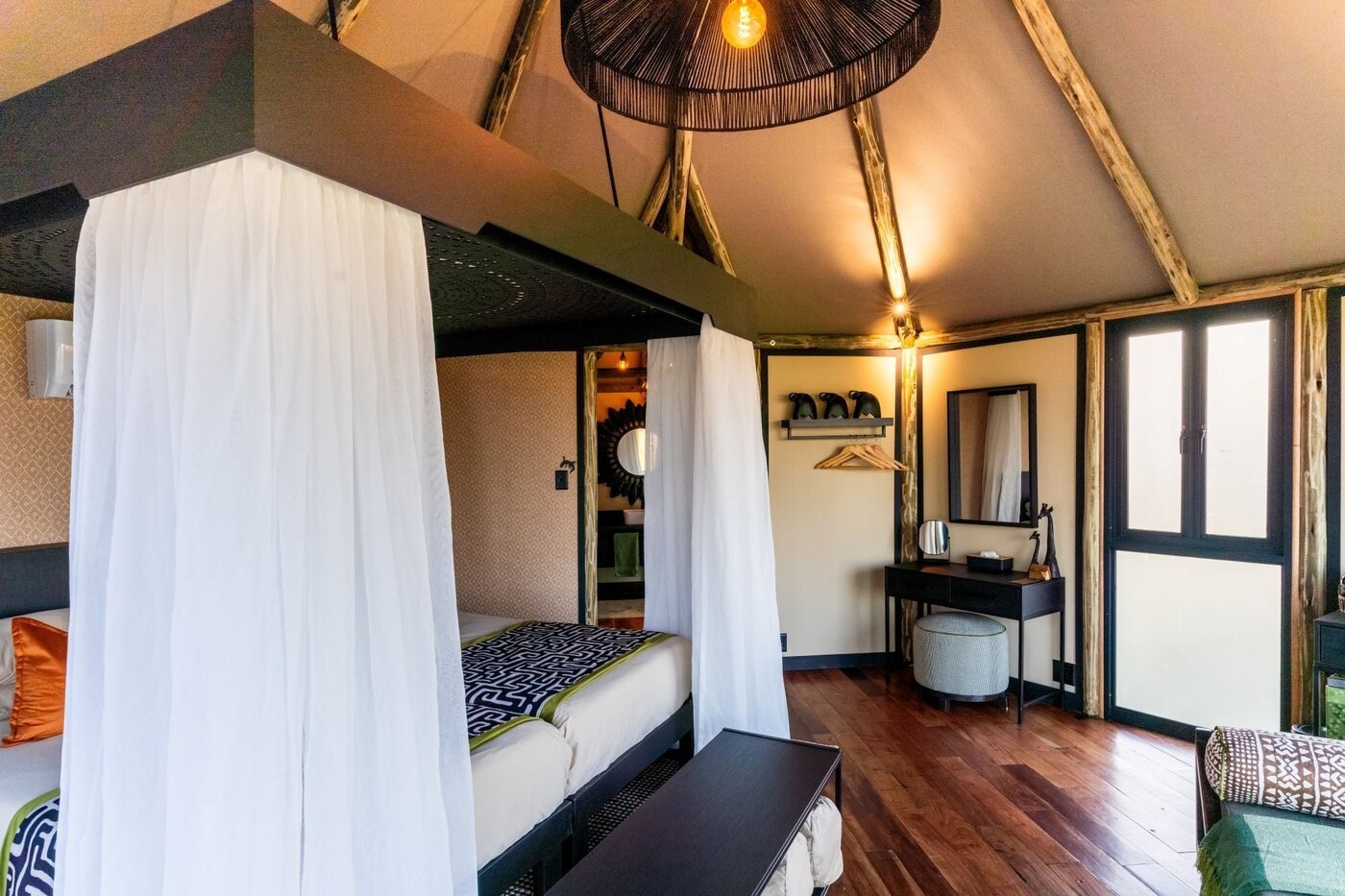 Twin-bed chalet interior at Chobe River Camp overlooking the Chobe River