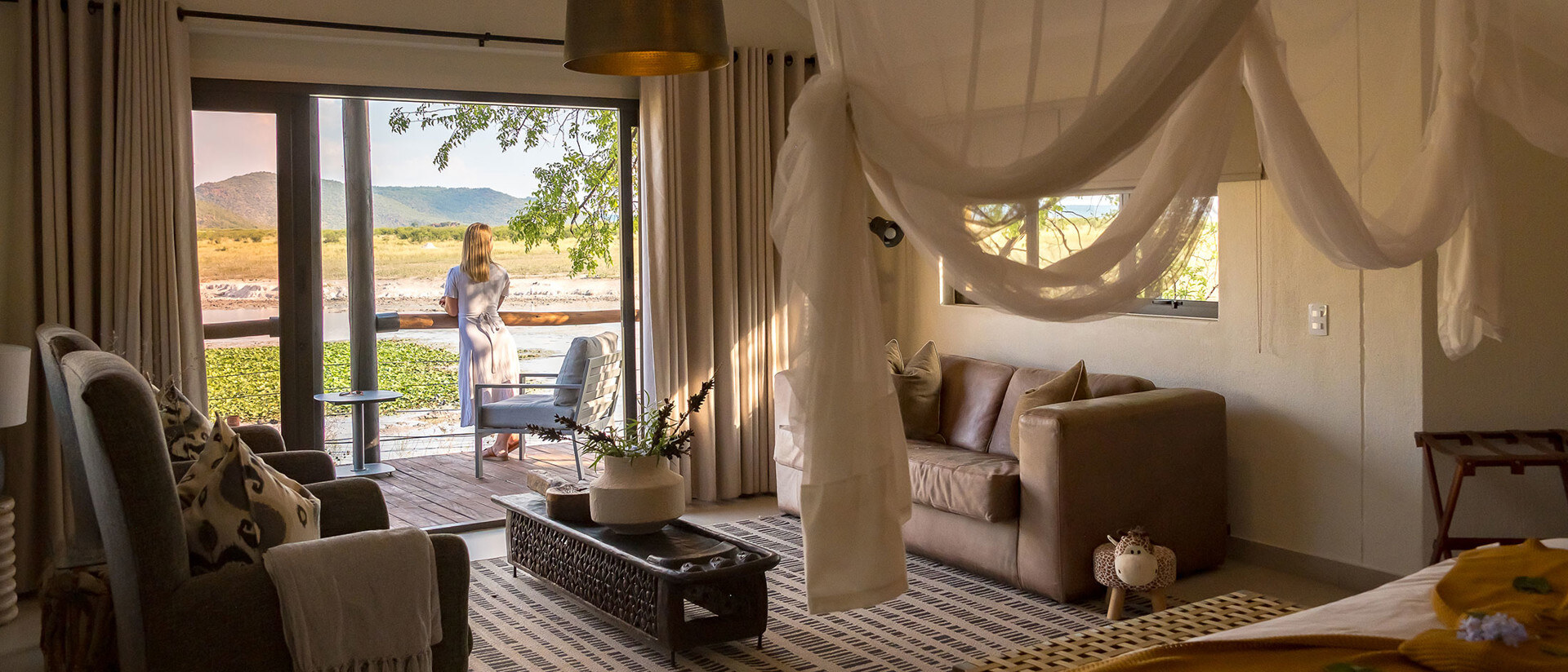 Tau Game Lodge deck overlooking the natural waterhole