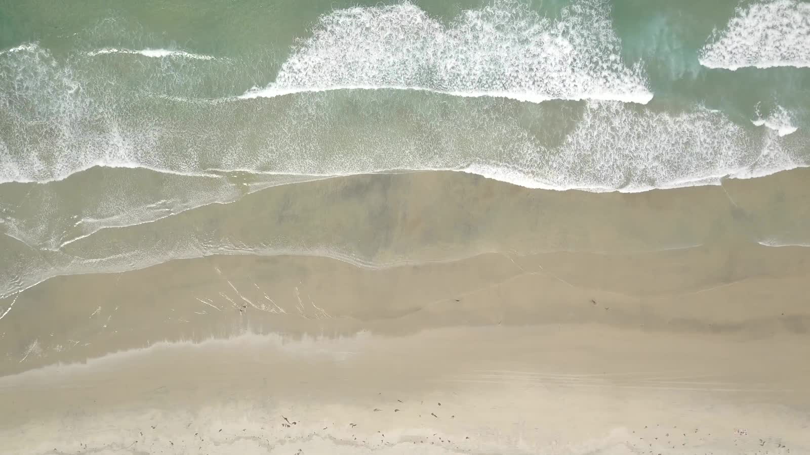 Turquoise waves on a deserted beach