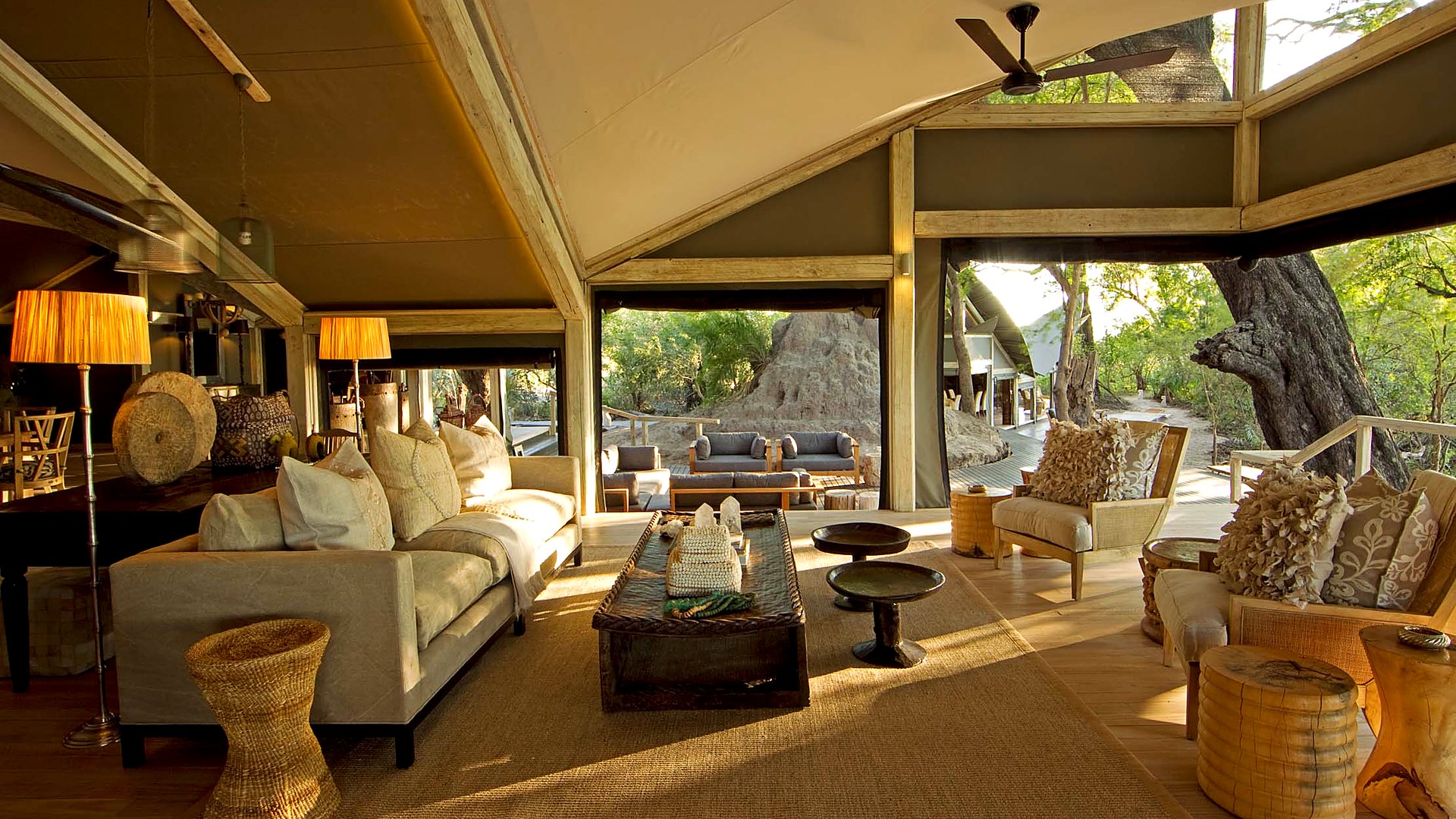 Abu Camp's main lounge pavilion overlooking the Okavango Delta floodplain at dusk