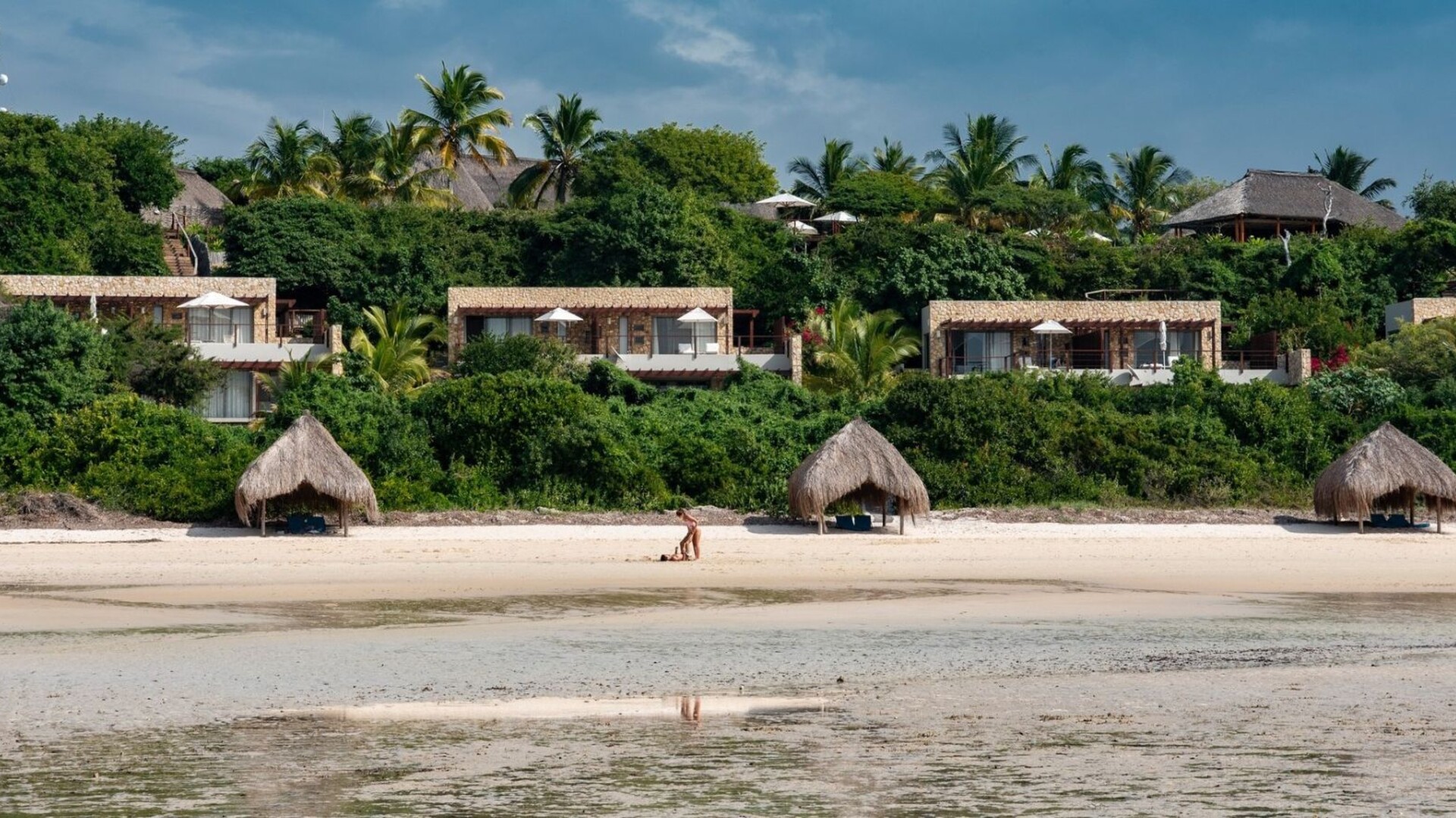 Aerial view of Bahia Mar Club on a lush hillside in Vilanculos, overlooking the Indian Ocean and Bazaruto Archipelago — Mozambique's mainland wellness retreat