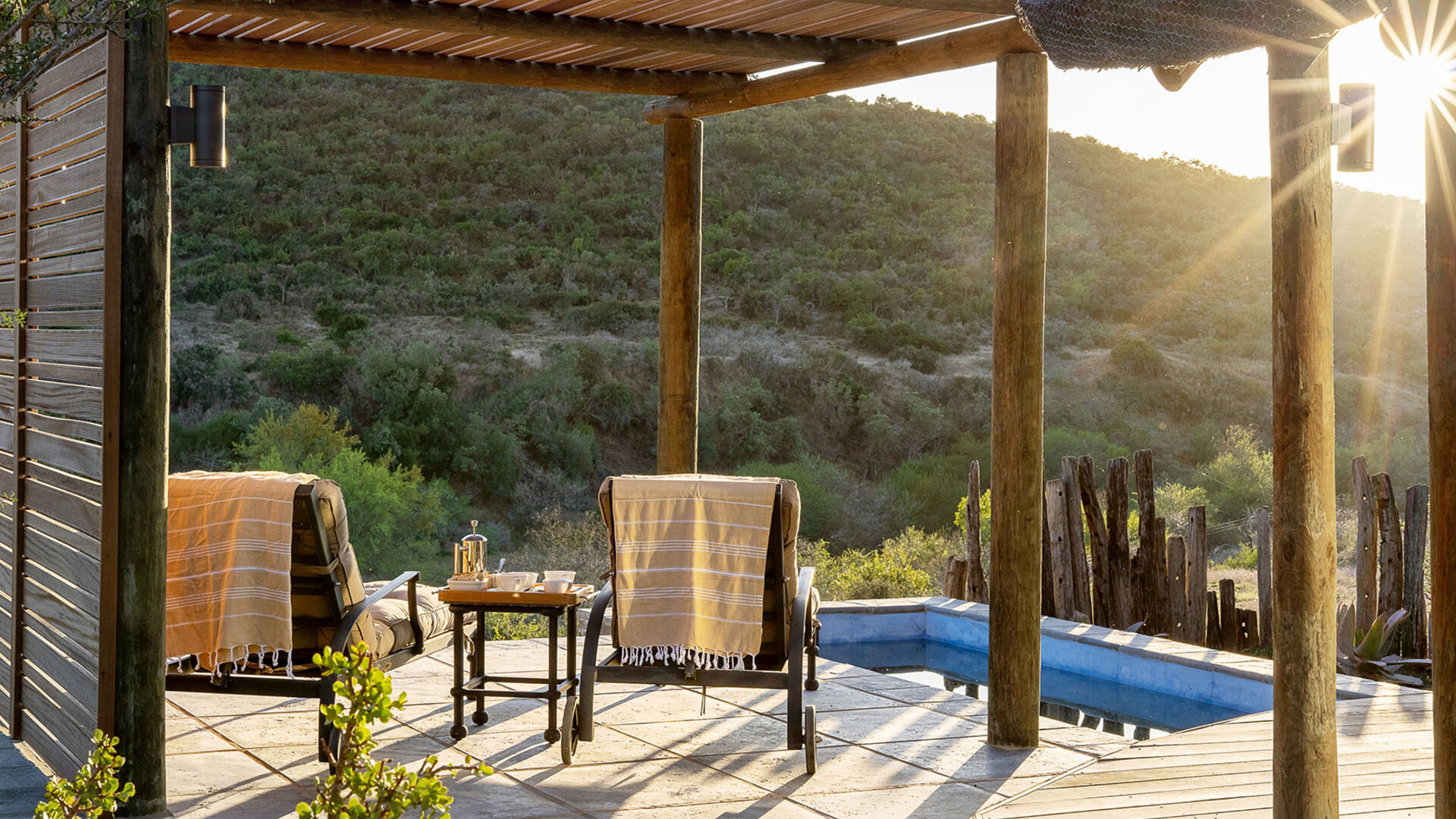 A 5-star Eastern Cape lodge suite with a private deck and plunge pool overlooking the reserve at sunset