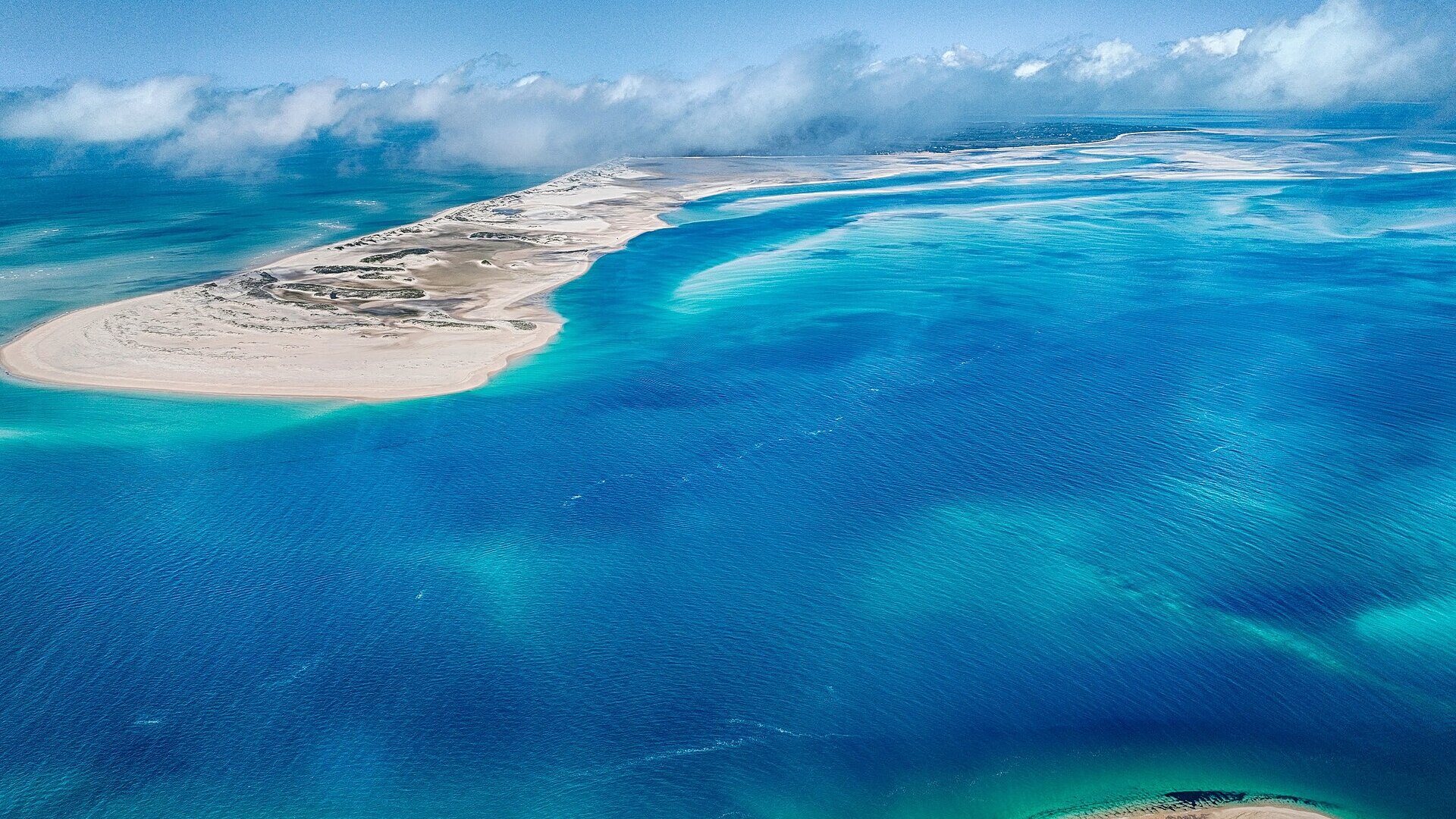 Aerial view of a turquoise lagoon and white sandbar in the Bazaruto Archipelago, Mozambique