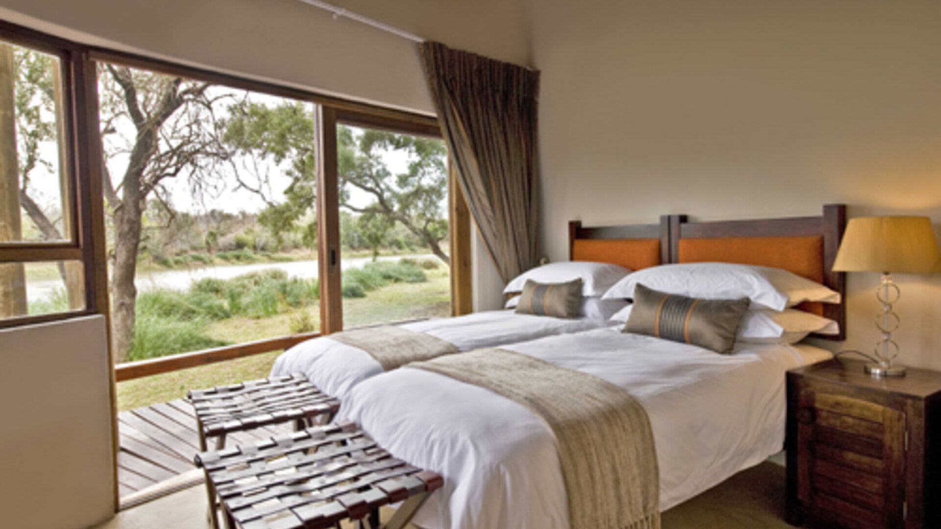 Romantic honeymoon villa with a private plunge pool overlooking a turquoise Indian Ocean beach at sunset