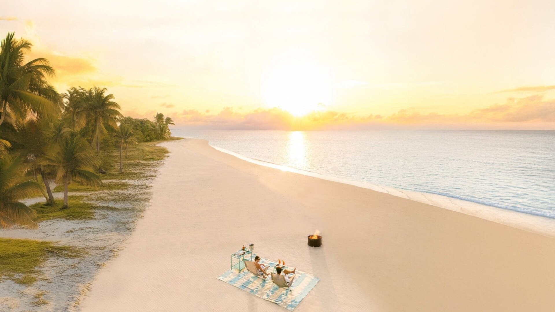 Aerial view of a luxury lodge on a private Madagascar island with turquoise waters and pristine beaches