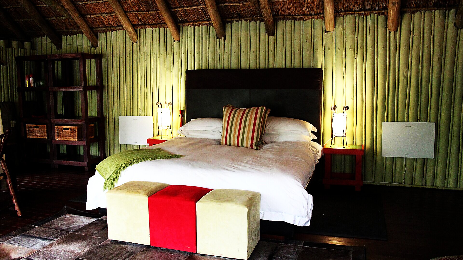 Refined safari suite in warm, earthy tones — luxury lodge, Zambia