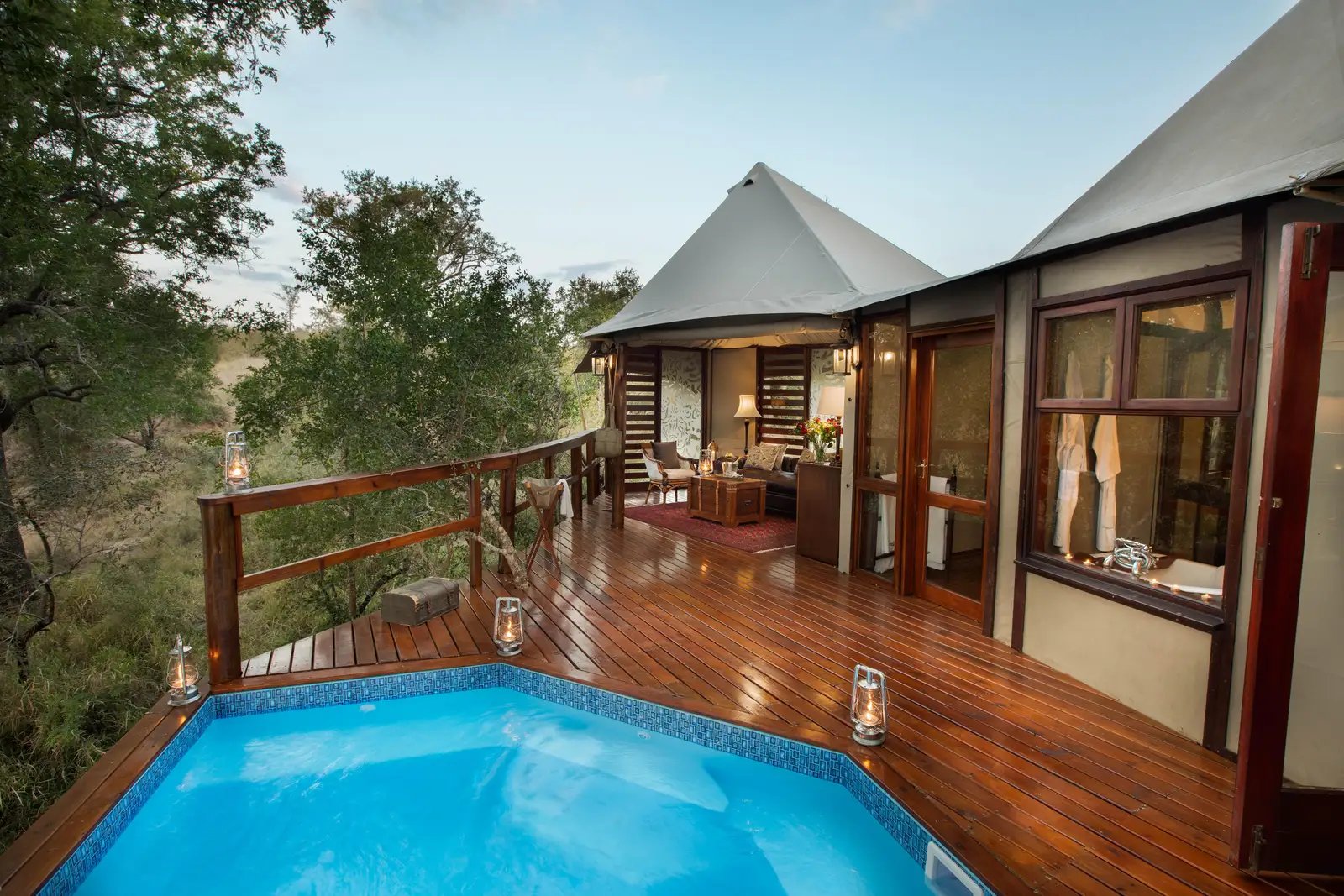 A luxury tented suite with a private plunge pool overlooking the Greater Kruger bushveld at sunrise