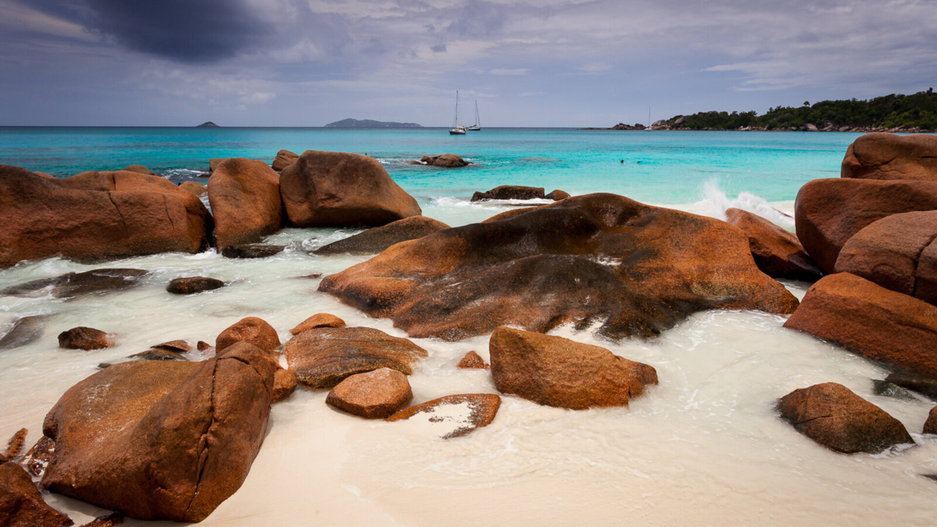 Granite boulders and turquoise water on a beach in Seychelles