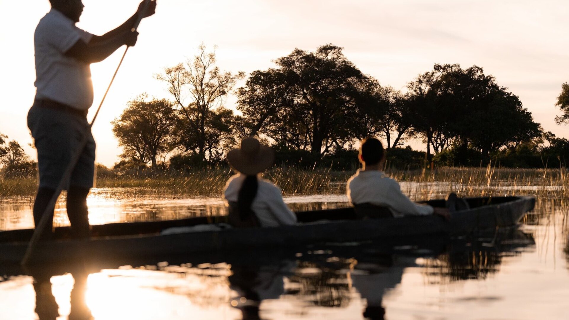 Elephants on a flooded Okavango Delta plain in Botswana — July to October is the best time to visit Botswana for safari