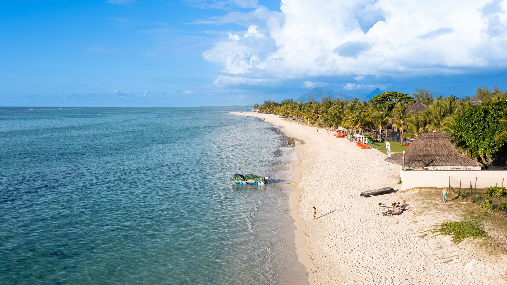 Aerial view of the Le Morne peninsula, turquoise lagoon and white beaches of Mauritius — the cool, dry winter from May to December is the best time to visit Mauritius