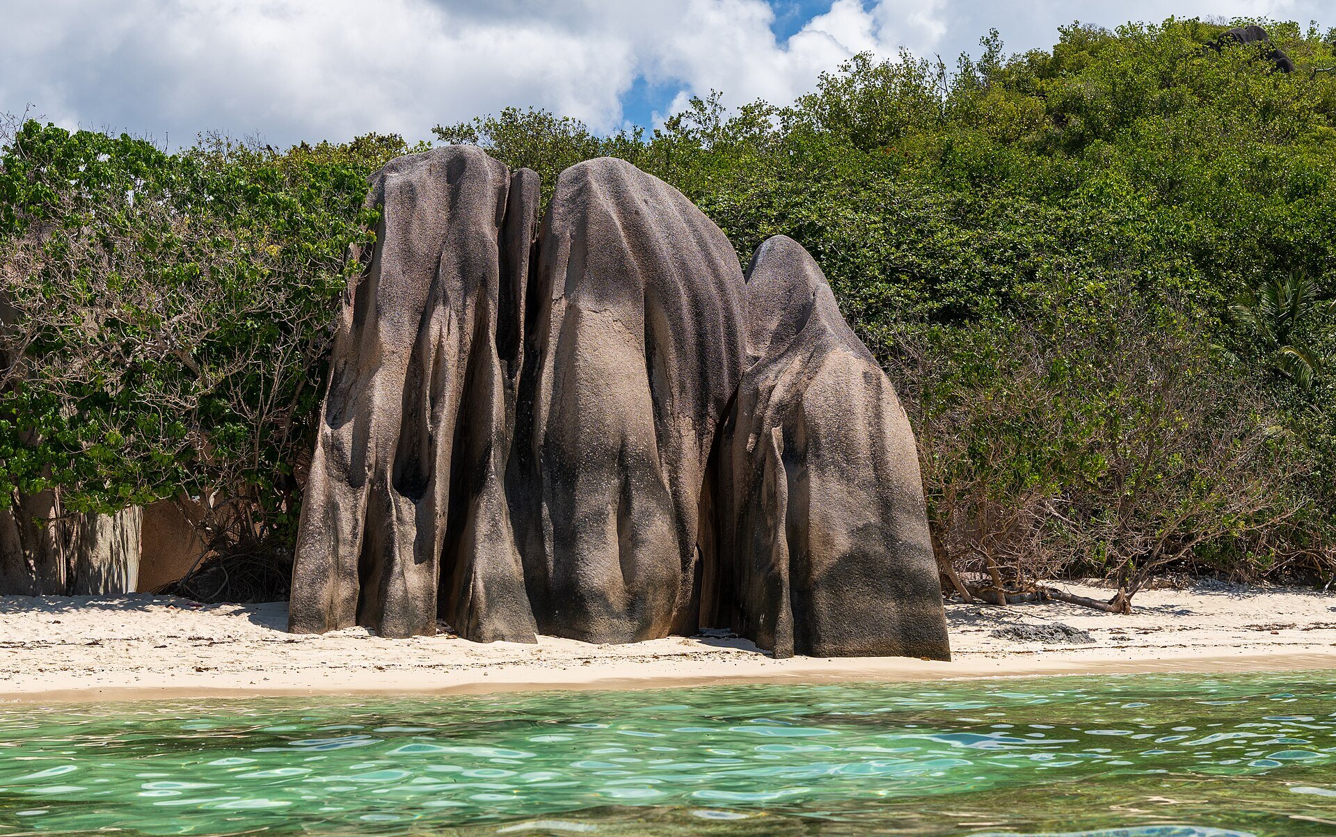 Pink granite boulders and turquoise water at Anse Source d'Argent, La Digue — the calm months of April and October are the best time to visit Seychelles